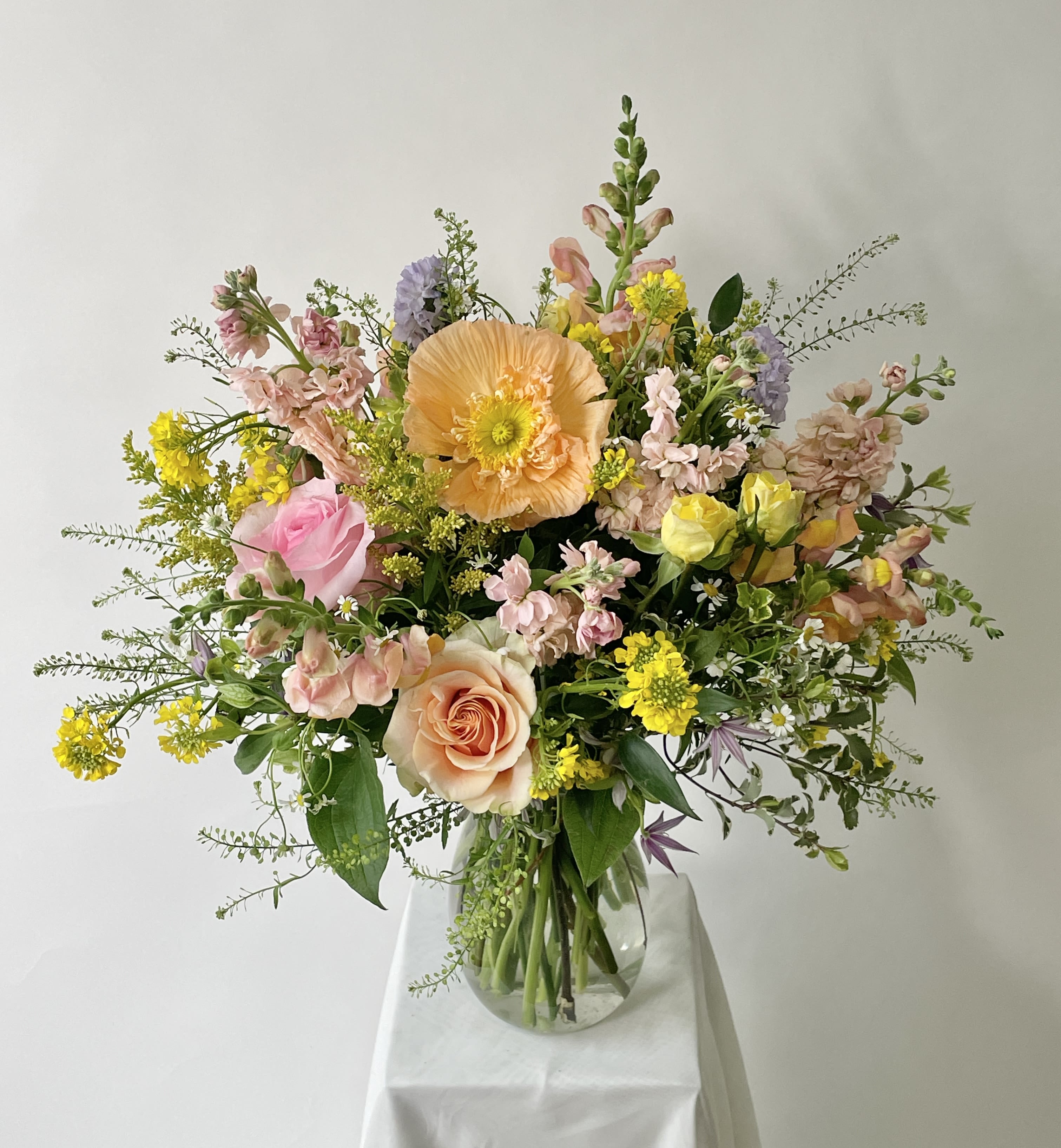 Persephone  Persephone  - ***THIS IS A SEASONAL DESIGNERS CHOICE ARRANGEMENT. MINIMUM OF 24 HOURS NOTICE.  Assorted florals are arranged elegantly in this tall, 360 arrangement that gives off an effortless pulled from the garden vibe. Each one will be unique and feature florals and colors appropriate for the season. If you have any special requests for colors please let us know and we will do our best to accommodate.