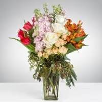 Burn Softly Burn Softly - This arrangement contains alstroemeria, tulips, roses, and other seasonal blooms. APPROXIMATE DIMENSIONS: 13" L x 11" W x 22" H