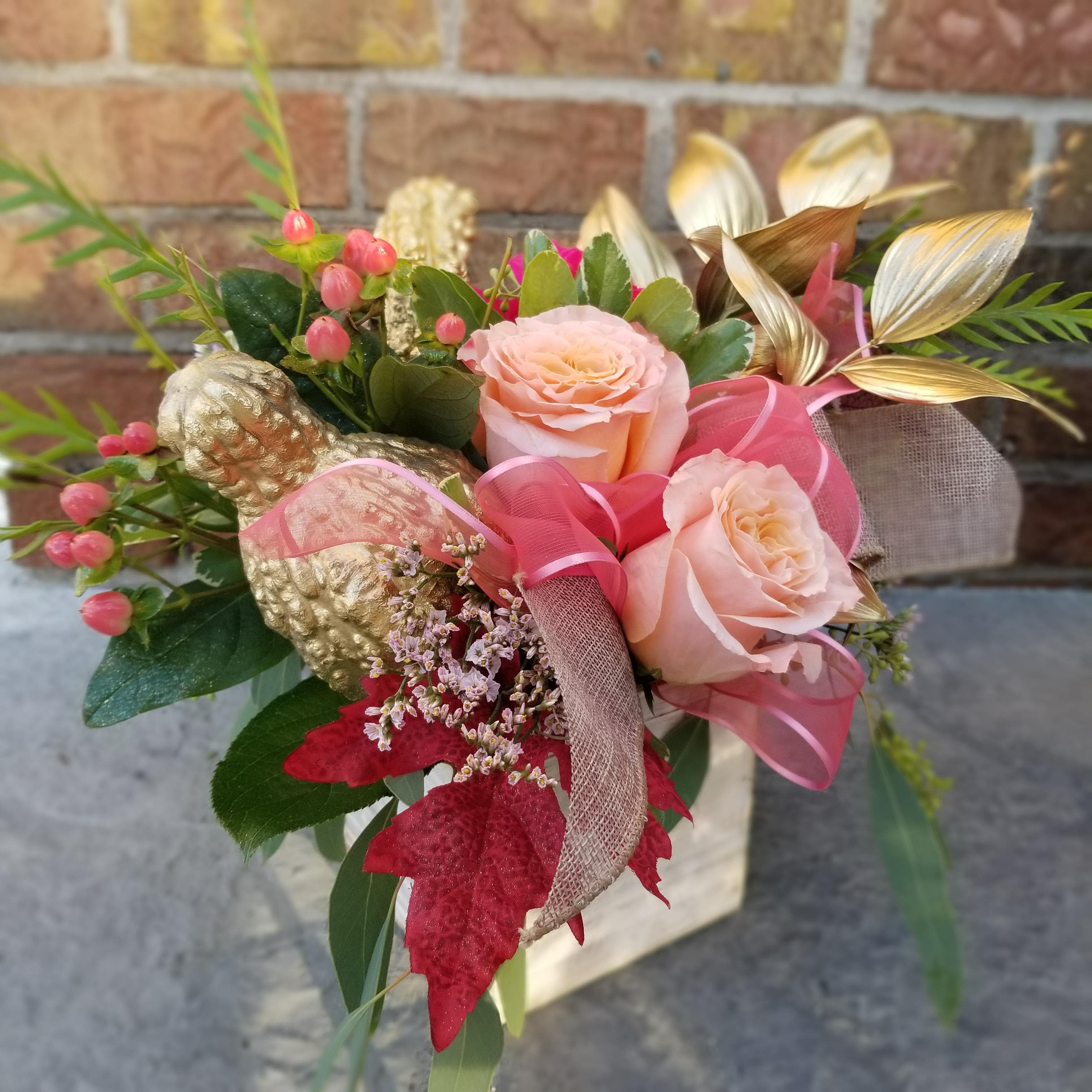 Golden Autumn by MG Florist - This beautiful arrangement is designed in a wooden white washed box.  Flowers included are roses, hypericum berries, statice, accented with gold gourds, ribbon, gold leaves, fall leaves, and a variety of greenery. Colors may vary.
