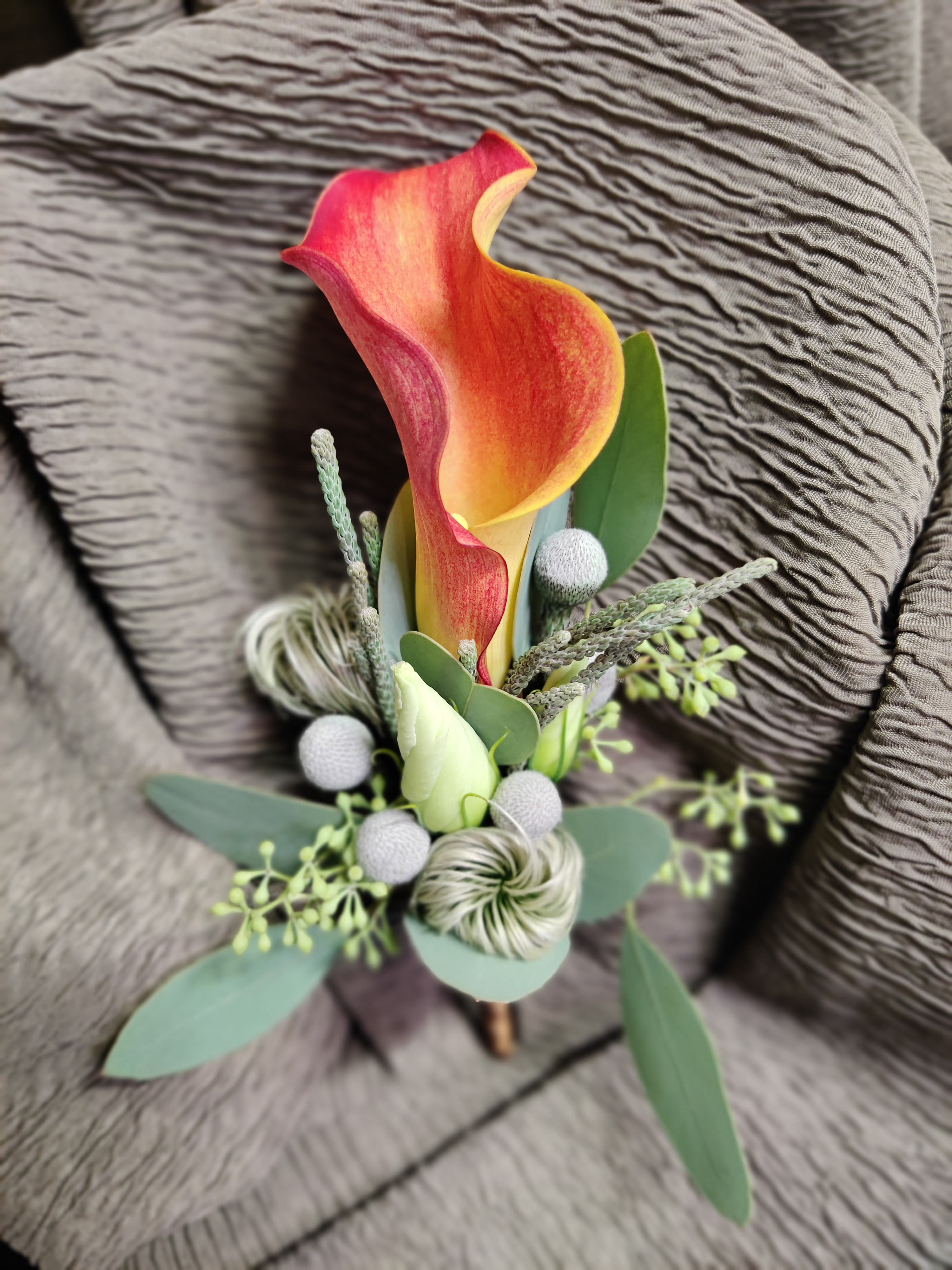 Boutonniere - Custom colors can be requested Boutonniere - Custom colors can be requested - Your wearable boutonniere can be any custom colors you request, provided you order a few days in advance. We can add seasonal accents or leave it plain and more modern with just foliage. Let us know the occasion and garment colors for best outcome.