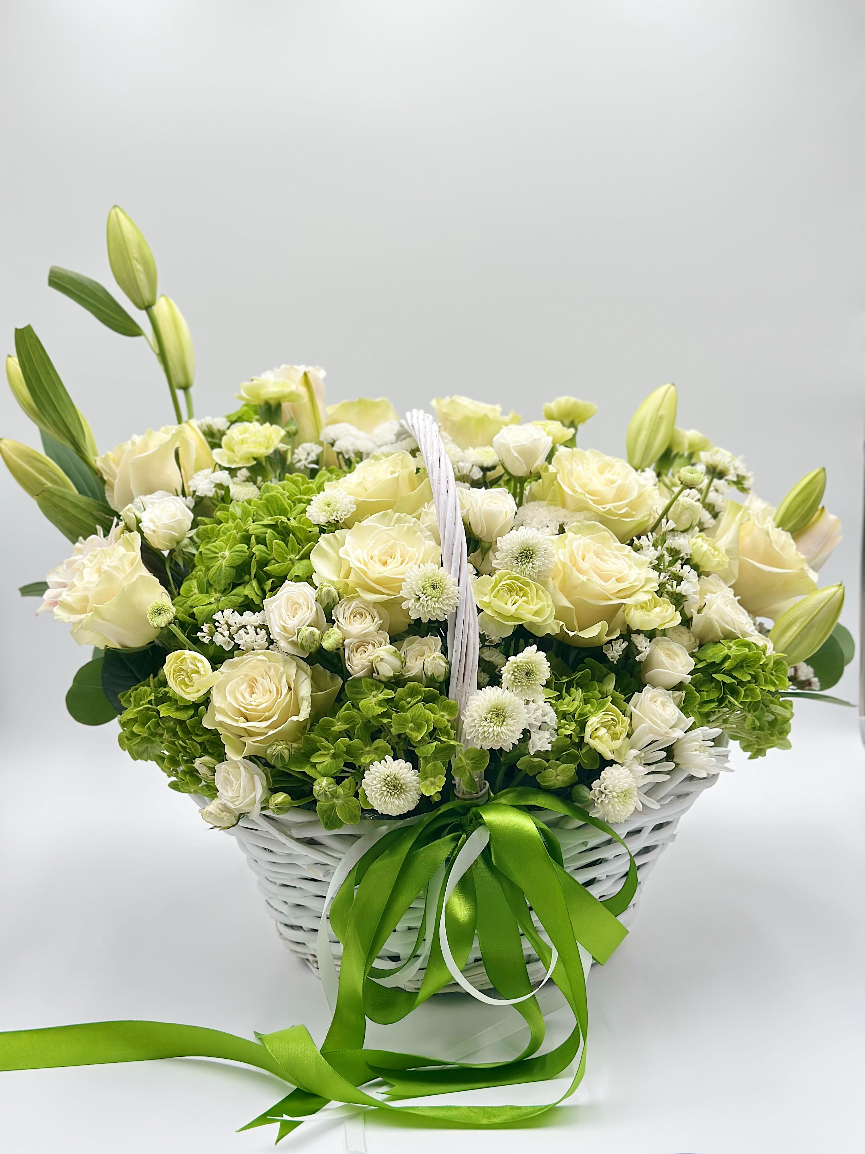 Green Morning Green Morning - An elegant floral basket in white and green tones — the embodiment of natural harmony and refined beauty. Pristine white Mondial roses, known for their perfect shape and delicate fragrance, pair beautifully with lush green hydrangeas, evoking a sense of freshness and lightness. The soft palette symbolizes purity, sincerity, and tranquility.  A perfect gift for those who appreciate timeless elegance and natural grace.
