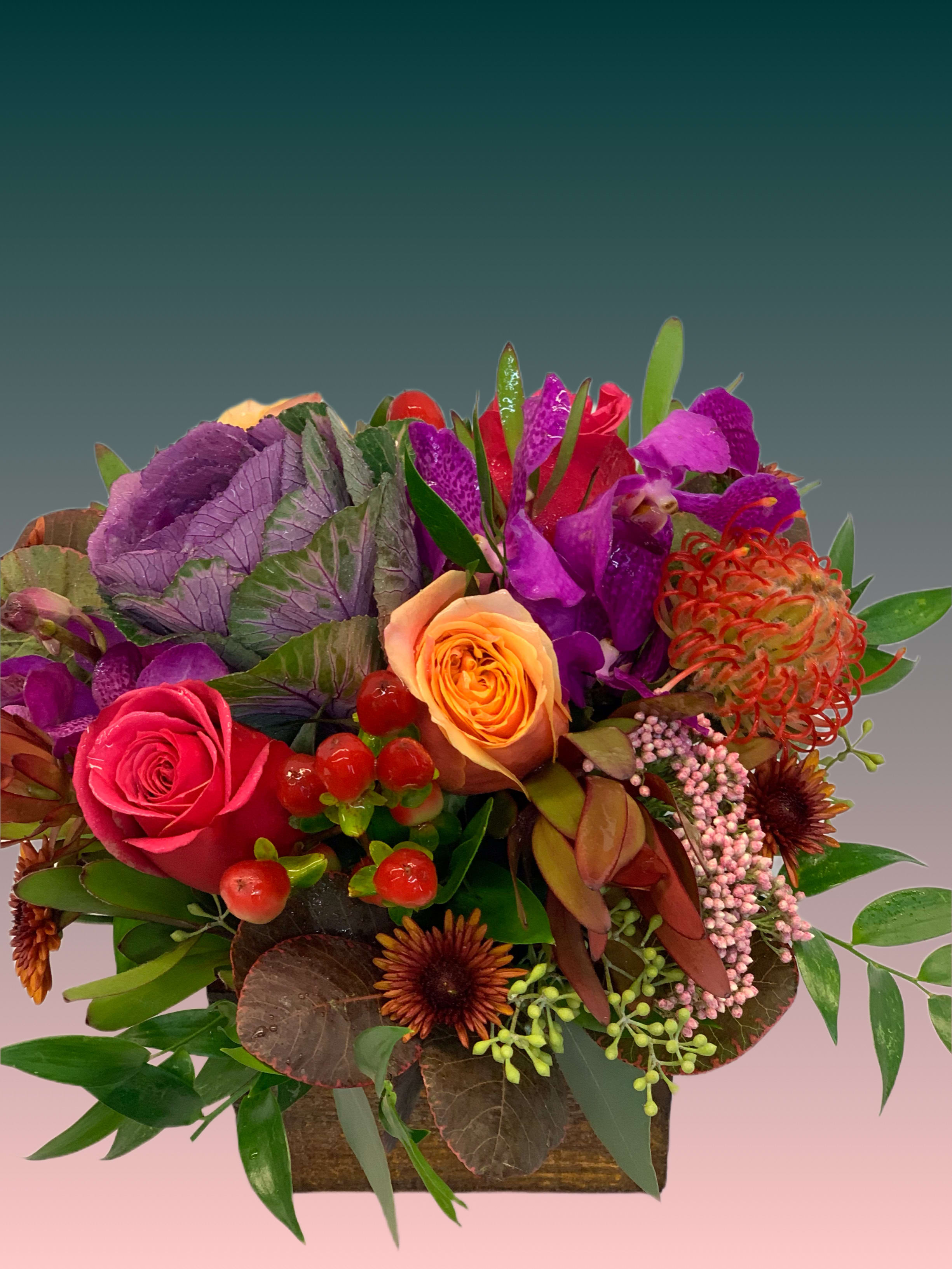 Fall Magic - Beautiful plums, magenta, peaches with assorted greens designed in a wood box or crystal vase 