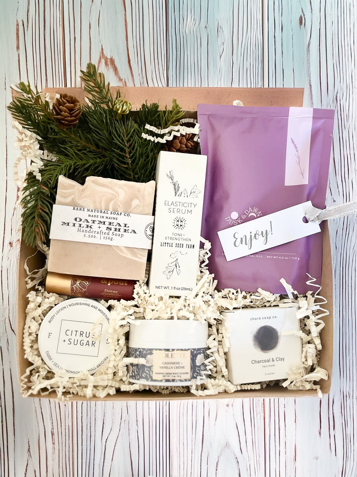 Cashmere Luxe Gift Box  Cashmere Luxe Gift Box  - Send a bit of peaceful pampering with our Cashmere Luxe gift box. This selection includes a handmade soap bar, tinted lip balm from Poppy & Pout, lavender bath soak, Liz's favorite Little Seed Farms Elasticity Serum ( so good ), a charcoal face mask from RI based Shore Soap Co, Farm + Sea body lotion and a tub of Cashmere Vanilla Body Scrub from Solette made right here in MA   Packaged in our signature Kraft gift box.