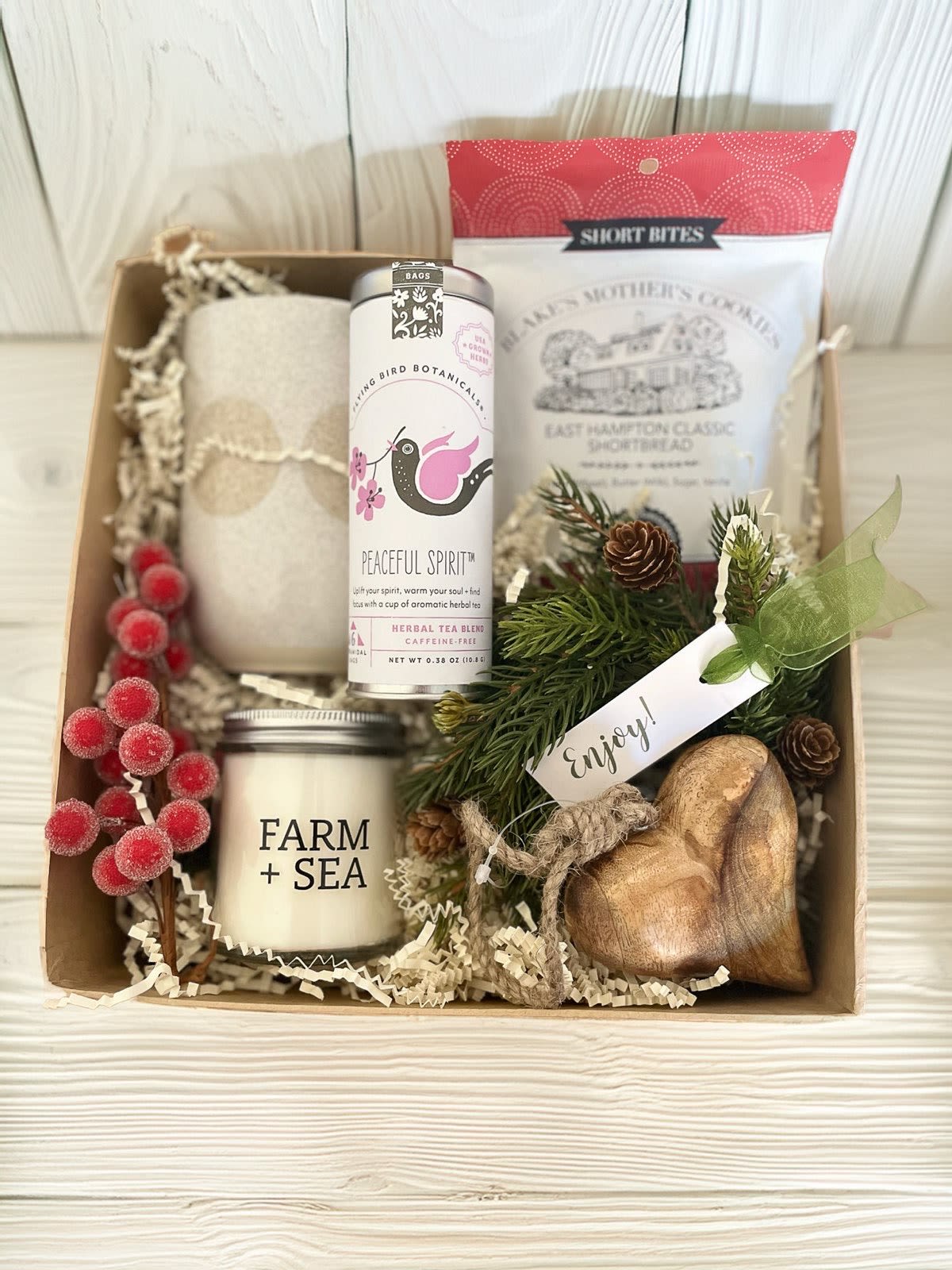 Cozy Moment Gift Box  - All you needs for a quiet cozy moment - an extra large mug, Peaceful Spirit herbal tea from Flying Bird Botanicals, mini shortbread cookies, a seasonal Farm + Sea candle and a carved wooden heart ornament for a little extra love.   Please note if you have a specific Farm + Sea fragrance you favor. Otherwise, we'll choose one of our shop favorites.  Packaged in our signature Kraft gift box.  
