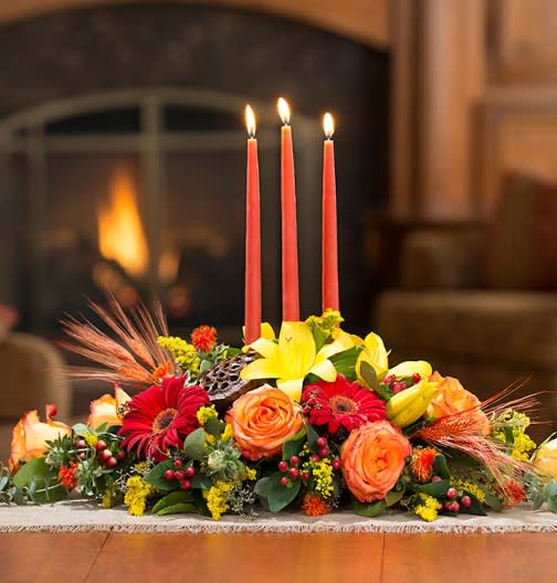 Three Candles by D Bryant Designer - This is a classic centerpiece with 3 candles to spread the warmth of the season.