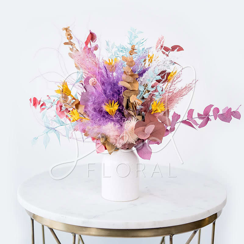 Forever Autumn Small - This all dried floral arrangement will last all autumn... and even then some! Featuring a mix of preserved dried flowers in warm autumn sunset hues in our modern Flynn White Specked Ceramic Vase. Approx 3.75&quot;  Each arrangement is handmade to order and ingredients/colors may vary slightly. Please also note, some shedding will occur.