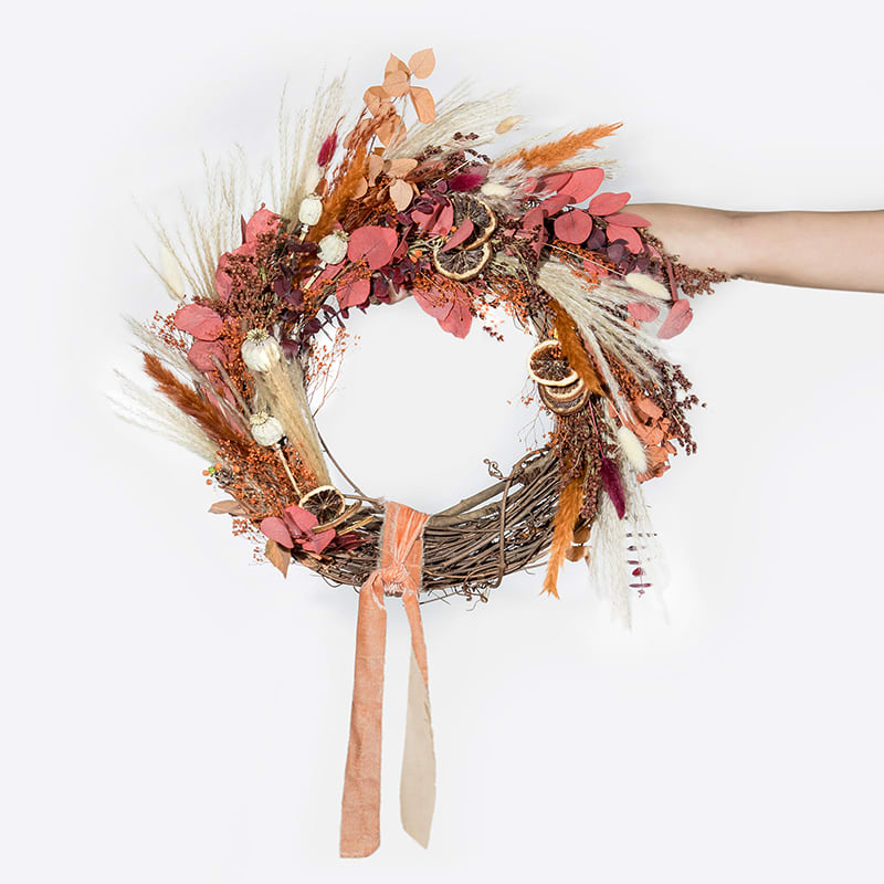 Forever Wreath - Citrus Forever Wreath - Citrus - This hand-made, asymmetrical wreath includes an assortment of dried florals and citrus in shades of cream, orange, terracotta, and red on a grapevine branch wreath. Yes, it will last forever!  Size: 12"