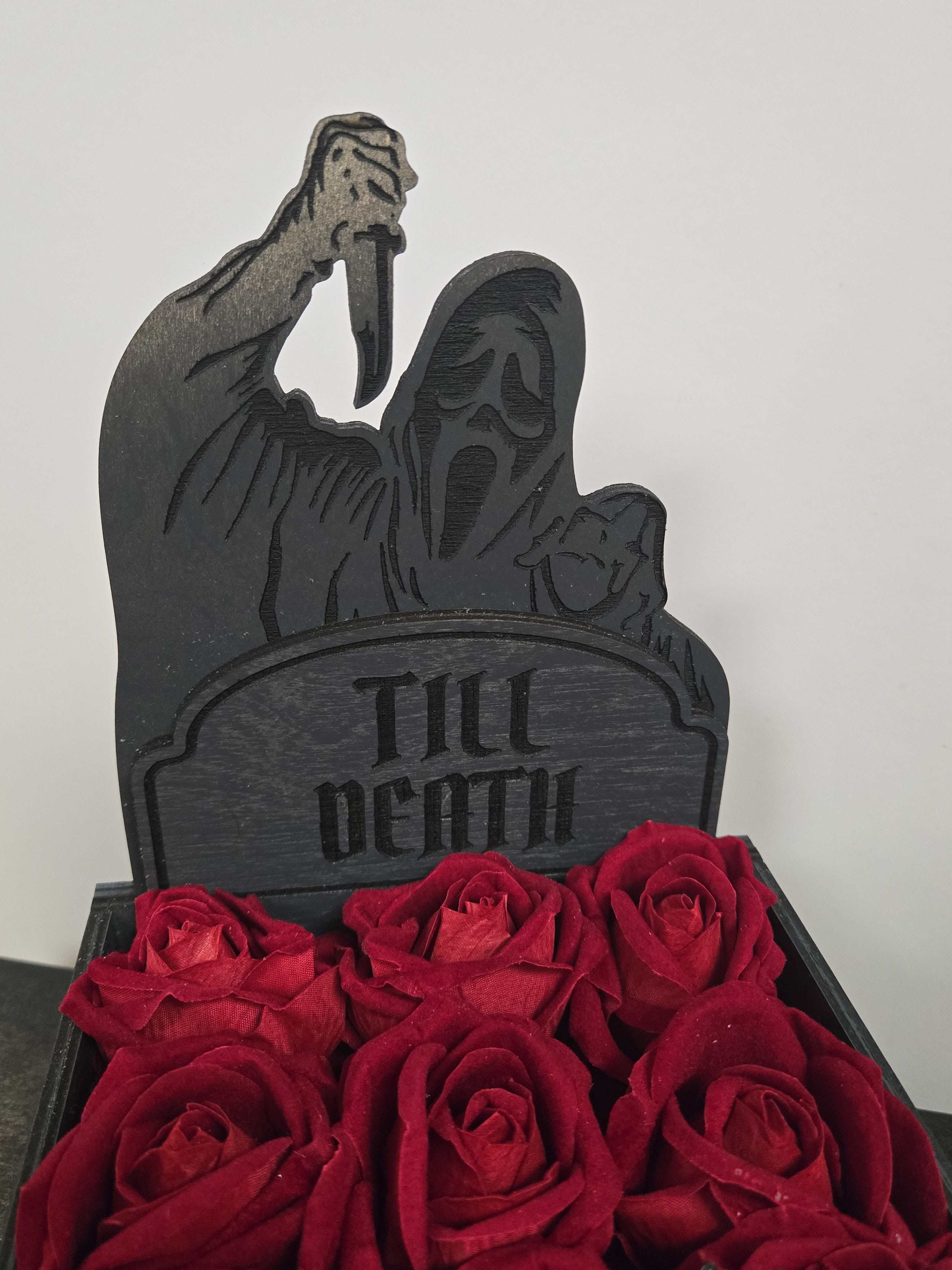 Killer Arrangement  - Have a love for Scream-ing? This Arrangement perfectly blends Horror and Romance.  Perfect for Spooky Anniversaries, Just Because, or for the special BOO in your life.     APPROX: 9 1/2&quot; H x 11&quot;L x 6 1/2&quot;W x 2 1/2&quot; D