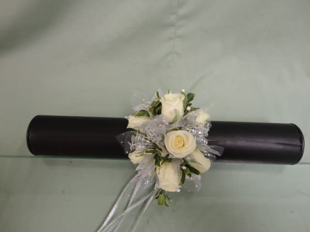 All White Corsage All White Corsage - Make your homecoming or prom night unforgettable with a stunning custom wrist corsage from Haehn Florist & Greenhouses! Each corsage is handcrafted by our talented designers to perfectly match your dress, suit, or theme.   Choose from elegant roses, delicate orchids, or trendy blooms accented with ribbons, sparkle, and greenery — designed to fit comfortably and beautifully on your wrist. Whether you prefer classic white roses, bold color combinations, or modern keepsake styles, we’ll create a look as unique as your night!   Perfect for:  Homecoming dances  Prom nights  Winter formals  Special events & banquets   Haehn Florist & Greenhouses 410 Hamilton Rd, Wapakoneta, OH 45895  419-738-8485  Convenient local delivery and in-store pickup available.   Order early — wrist corsages are custom-made and sell out fast during dance season!
