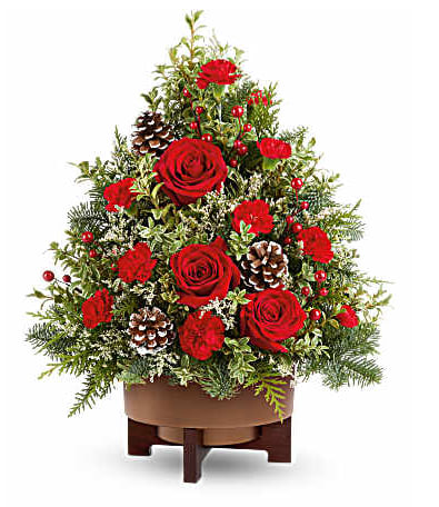 Teleflora's Season's Greetings Tree - Teleflora's Season's Greetings Tree spreads holiday cheer with red roses, festive greens, and pinecones in Teleflora's Modern Copper Planter. This floral tree makes a joyful Christmas gift or a cozy centerpiece for seasonal gatherings. Teleflora's Season's Greetings Tree includes red roses, red miniature carnations, white limonium, cedar, noble fir, and oregonia with pinecones, arranged in Teleflora's Modern Copper Planter Orientation: All-Around