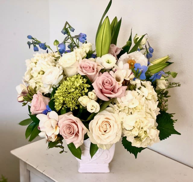 Cool Evening - Starting with a lovely white ceramic vase, We have combined Casa Blanca Lillies, white hydrangeas and creme roses to share sweet sentiments of sympathy or thoughtful pastels for any occasion  * please note that this arrangement has lilies, which are very toxic to cats. Please let me know if recipient has cats so I can replace lilies with other blooms. 