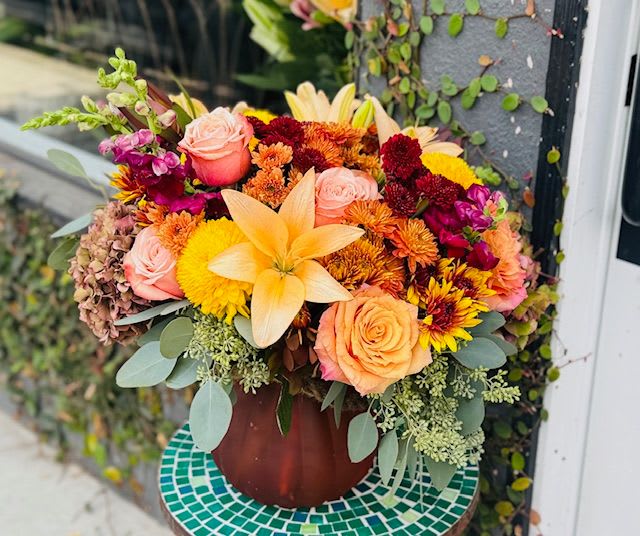 Autumn In Ojai Autumn In Ojai - A fall themed bouquet arranged in a glass pumpkin