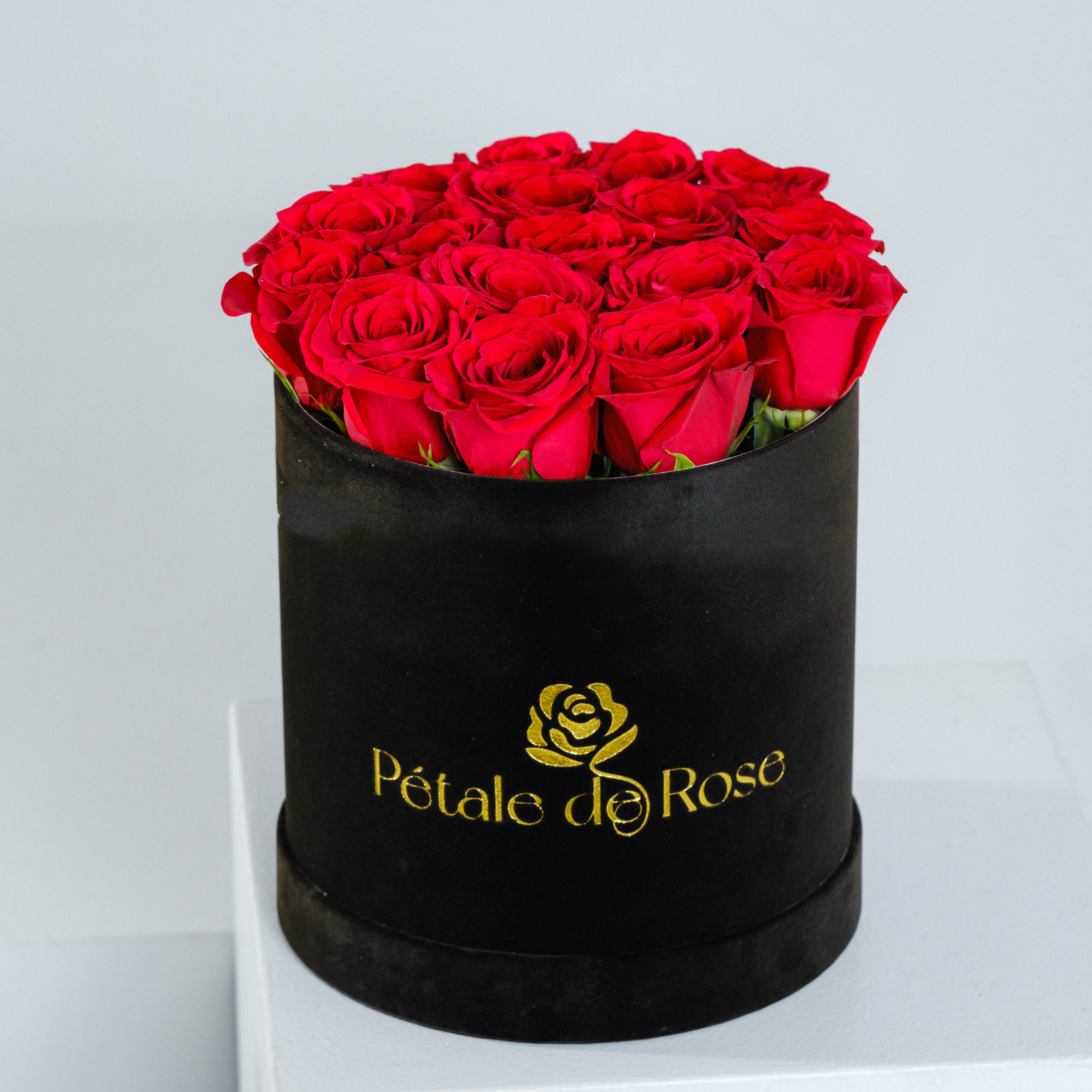Red Lovers Velvet - Express your feelings with our classic red roses and black velvet box Choose Deluxe or Premium to add extra blooms and make it more special!