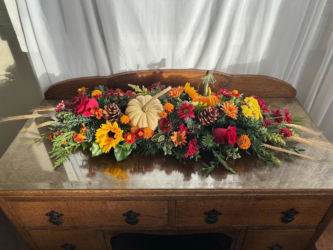 All The Friends And Family All The Friends And Family - An extra-long holiday centerpiece; but narrow so that it doesn't impede into place setting space.  Perfect for a large/long table with 12 or so guests.