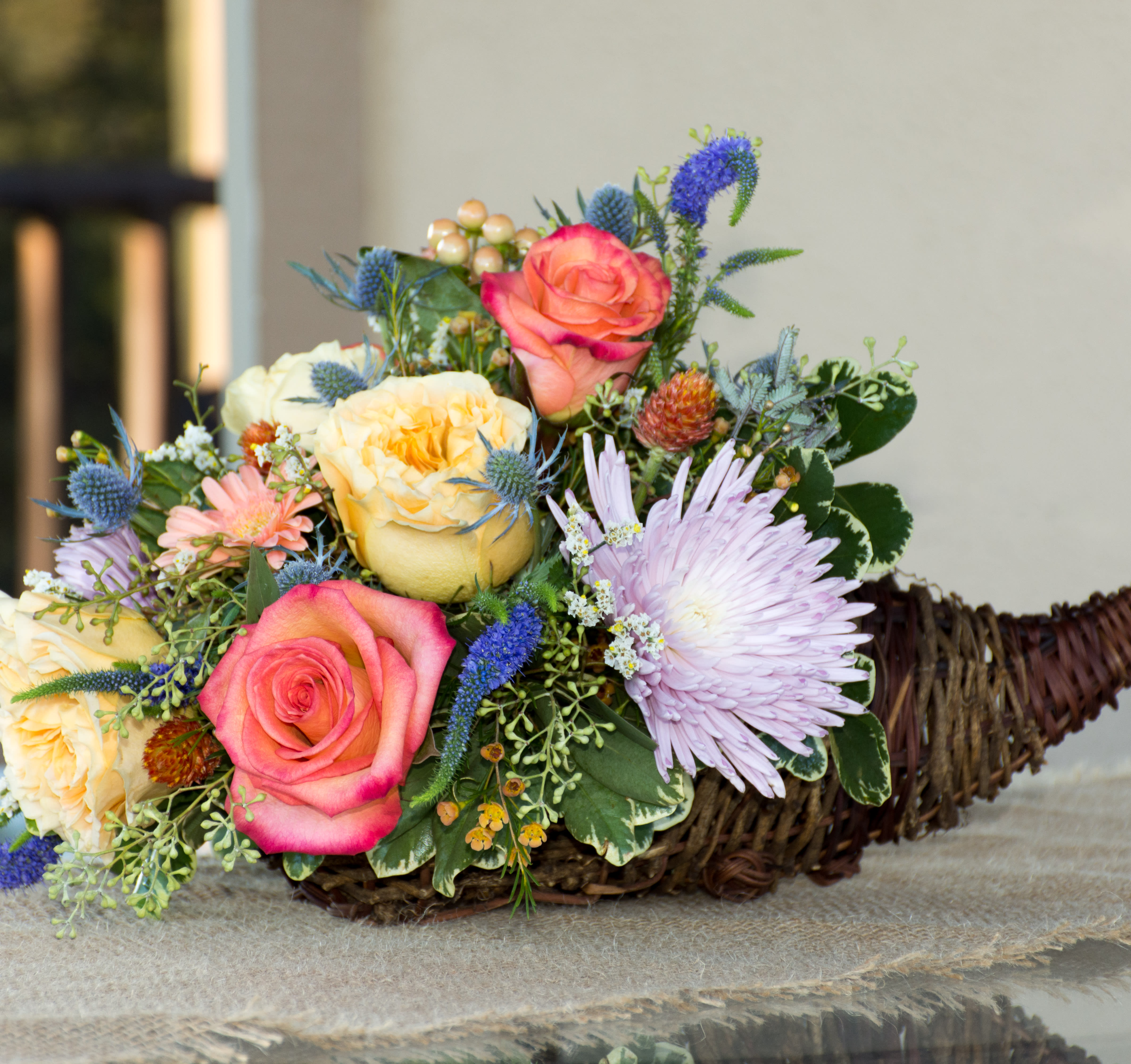Country Bounty Country Bounty - Cornucopia of Flowers.  Including  roses, mums, daisies,  and fall accent flowers.