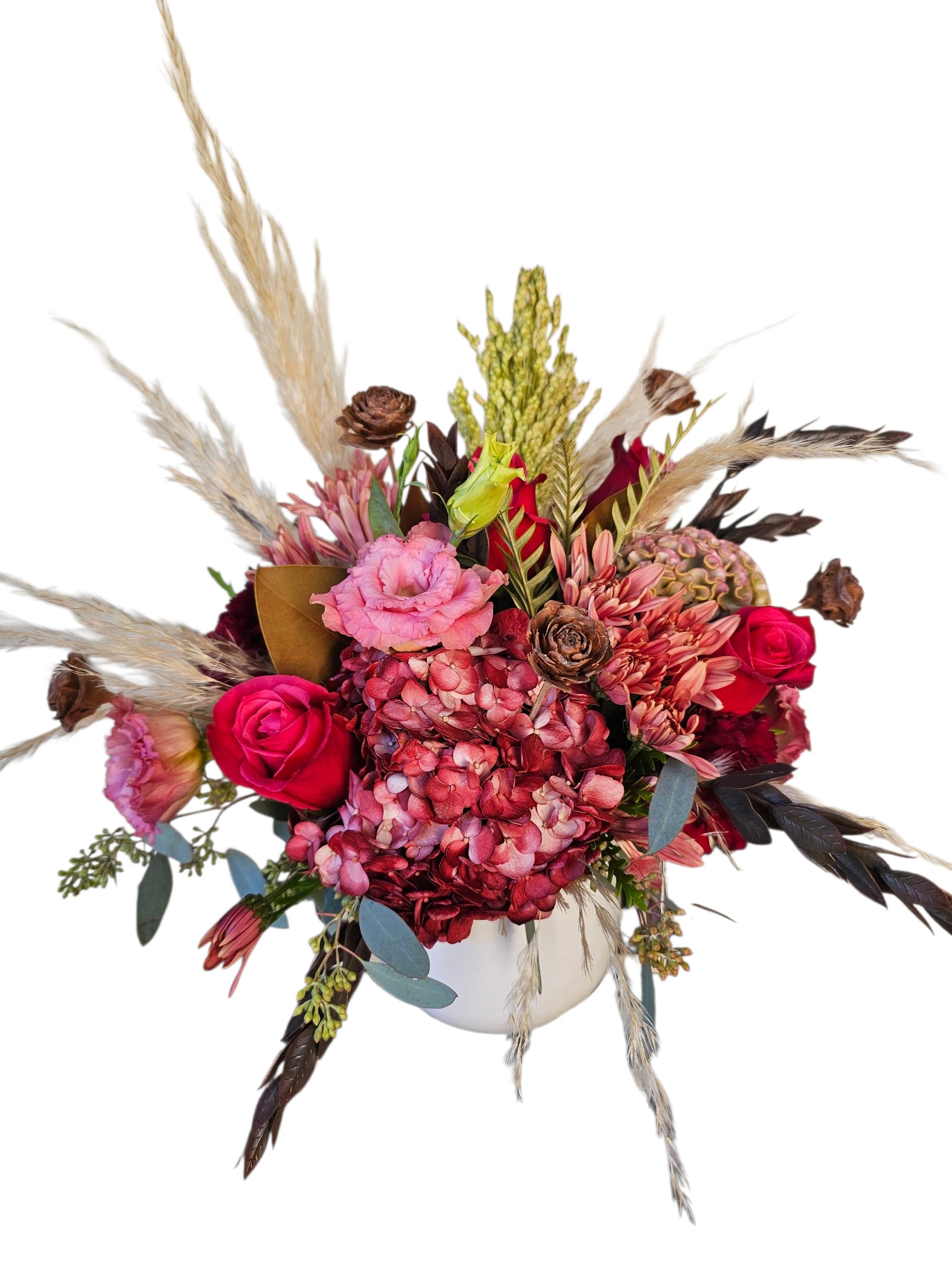 Cranberry Spice Cranberry Spice - An Autumn mix of greens highlight the burgundy hydrangea and pink roses arranged in a white ceramic vase.