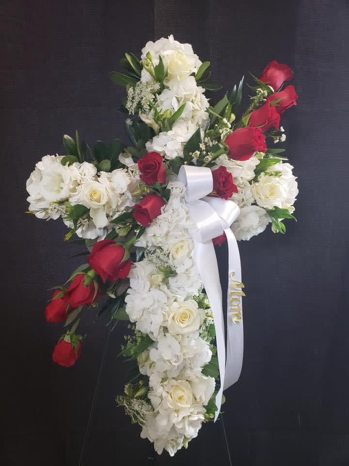 Traditional Cross with a bleed of 1 dozen roses. - Cross with rose bleed.