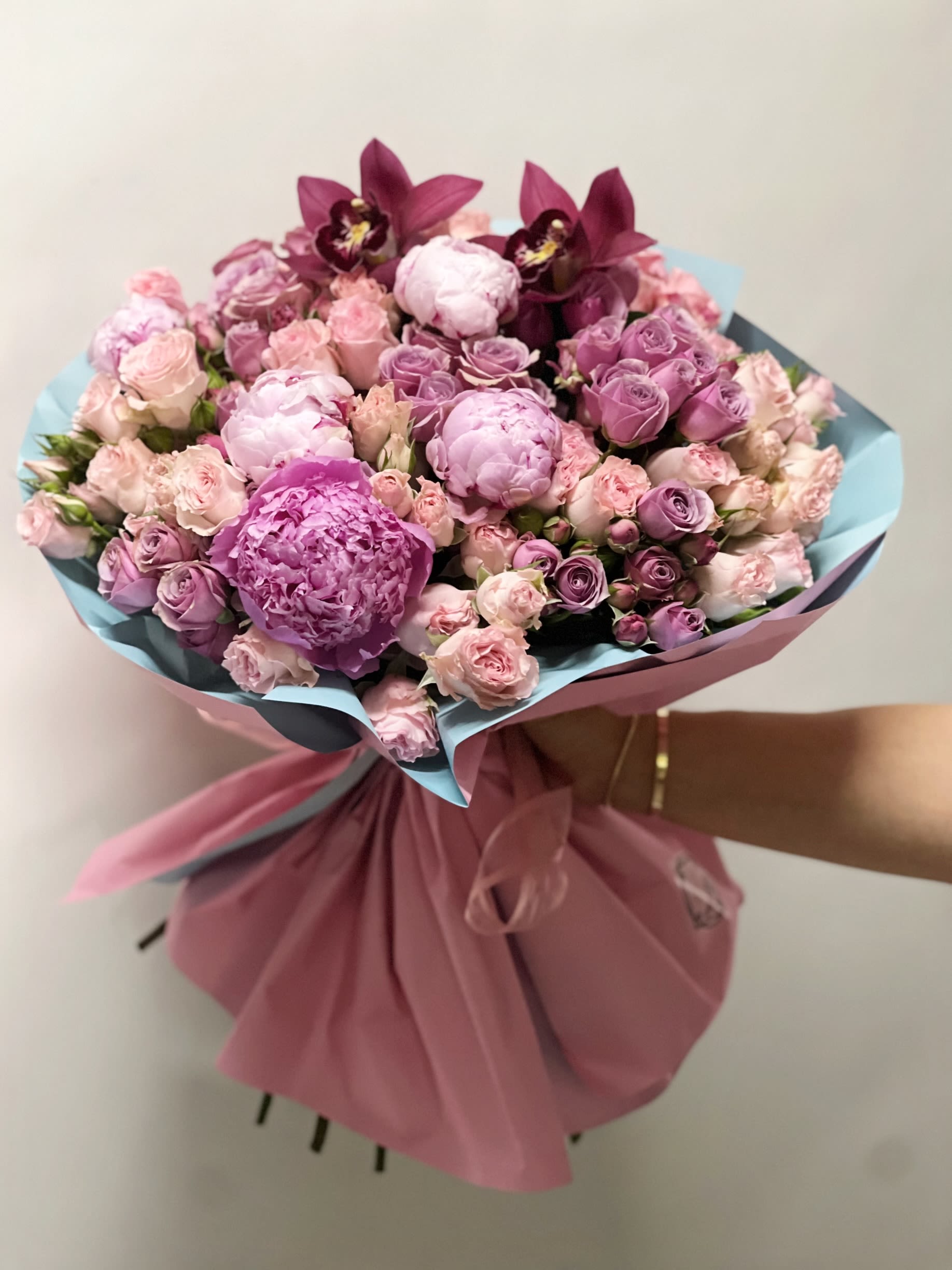 Sweet Amour  - A delicate blend of peonies, accented by elegant orchids and roses – our Sweet Amour bouquet is a romantic Mother’s Day gesture wrapped in pastel luxury. Perfect for the mom who adores soft florals.