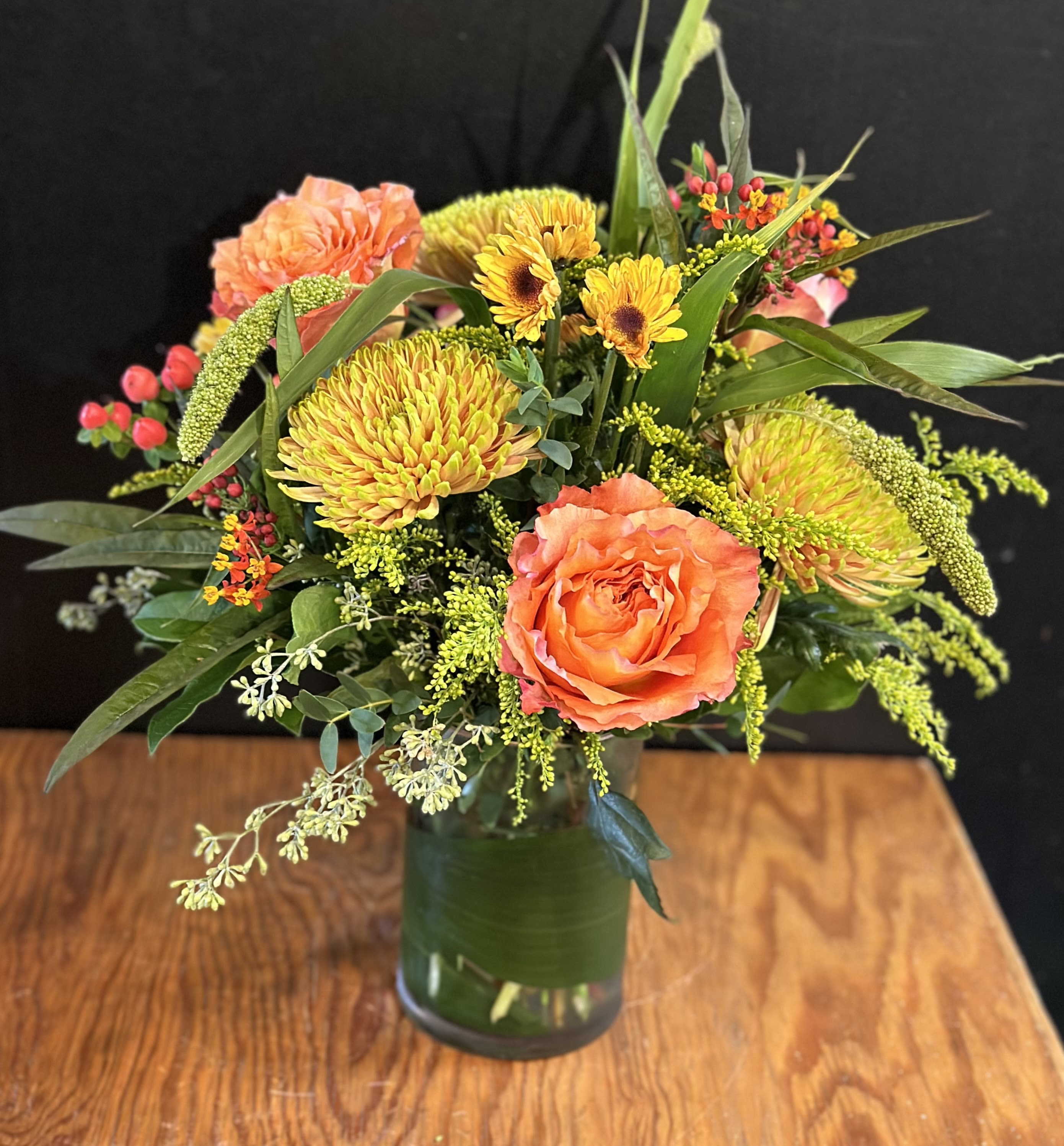 Fall Harvest - The fall season is upon and what better way to celebrate with this warm arrangement. chrysanthemums , roses and other seasonal accents are gathered in a vase  . Approx. 12&quot;h