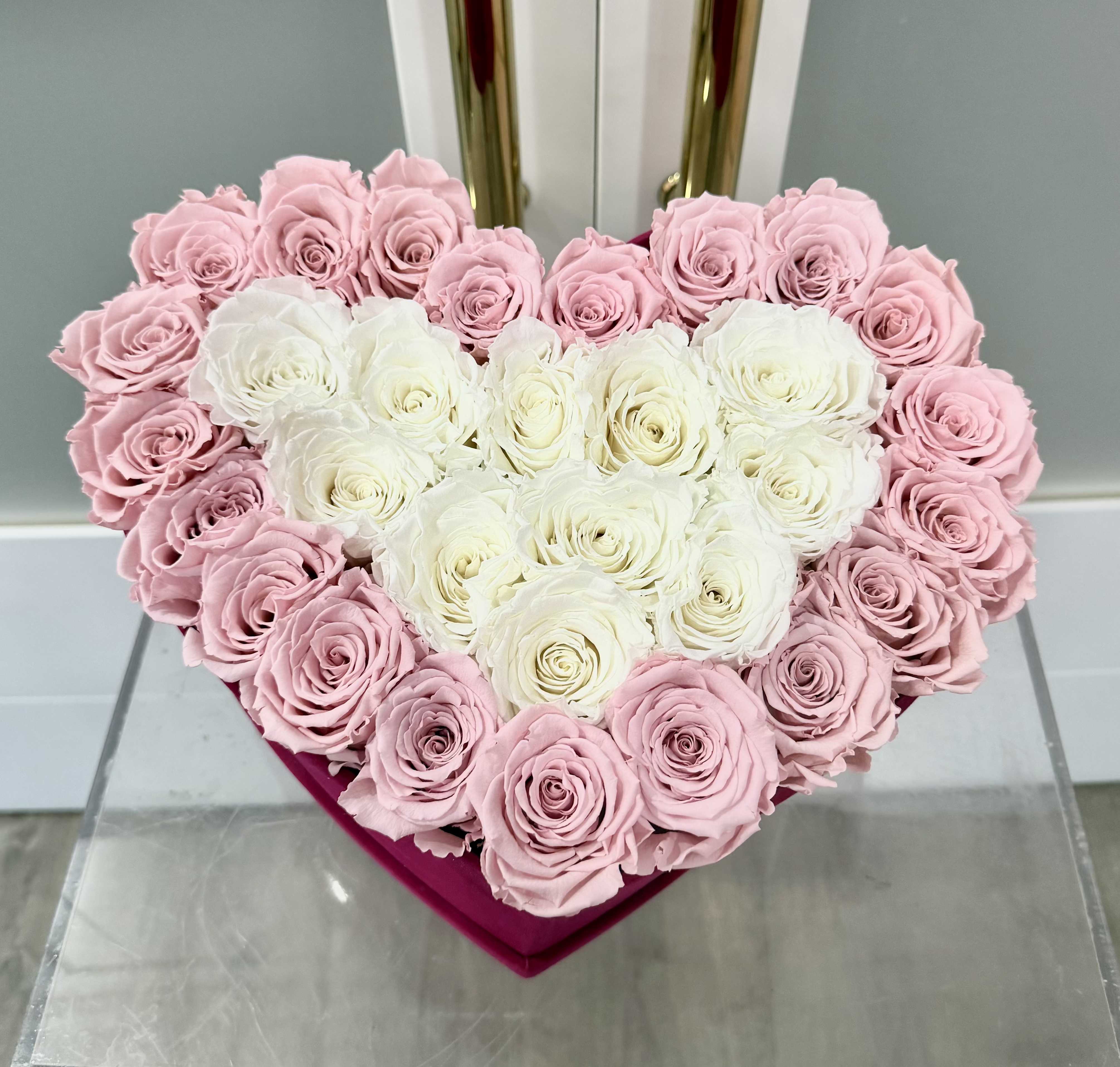 Preserved 31 Roses Heart Box - Express your deepest emotions with this breathtaking arrangement of 31 preserved pink and white roses, elegantly arranged in a heart box.   These roses are carefully preserved to retain their natural beauty, softness, and vibrant colors for up to a year or more. A perfect gift for a romantic occasions, birthday, or to simply say “I love you&quot;.      •    31 premium preserved red roses     •    Hand-arranged in a luxurious velvet heart box     •    Long-lasting and maintenance-free  Celebrate love that lasts forever with this timeless and elegant gift.