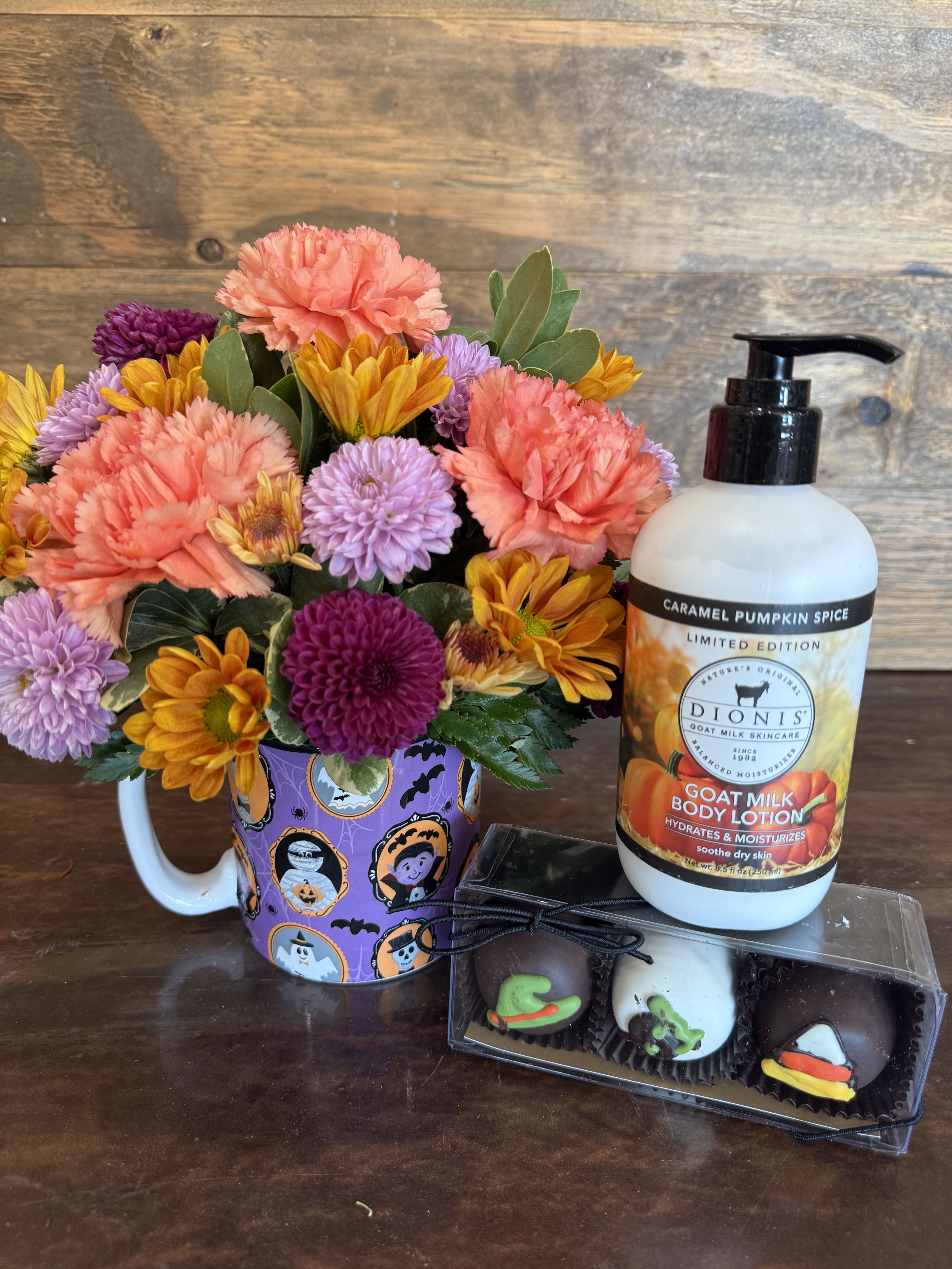 Ghouls Night Out Gifts! Ghouls Night Out Gifts! - Celebrate spooky season with a little cozy magic! This festive Halloween mug is filled with bright autumn blooms, paired with caramel pumpkin spice goat milk lotion and delicious Halloween truffles. A sweet treat for yourself or a “boo-tiful” gift for someone special who loves all things fall and fun!