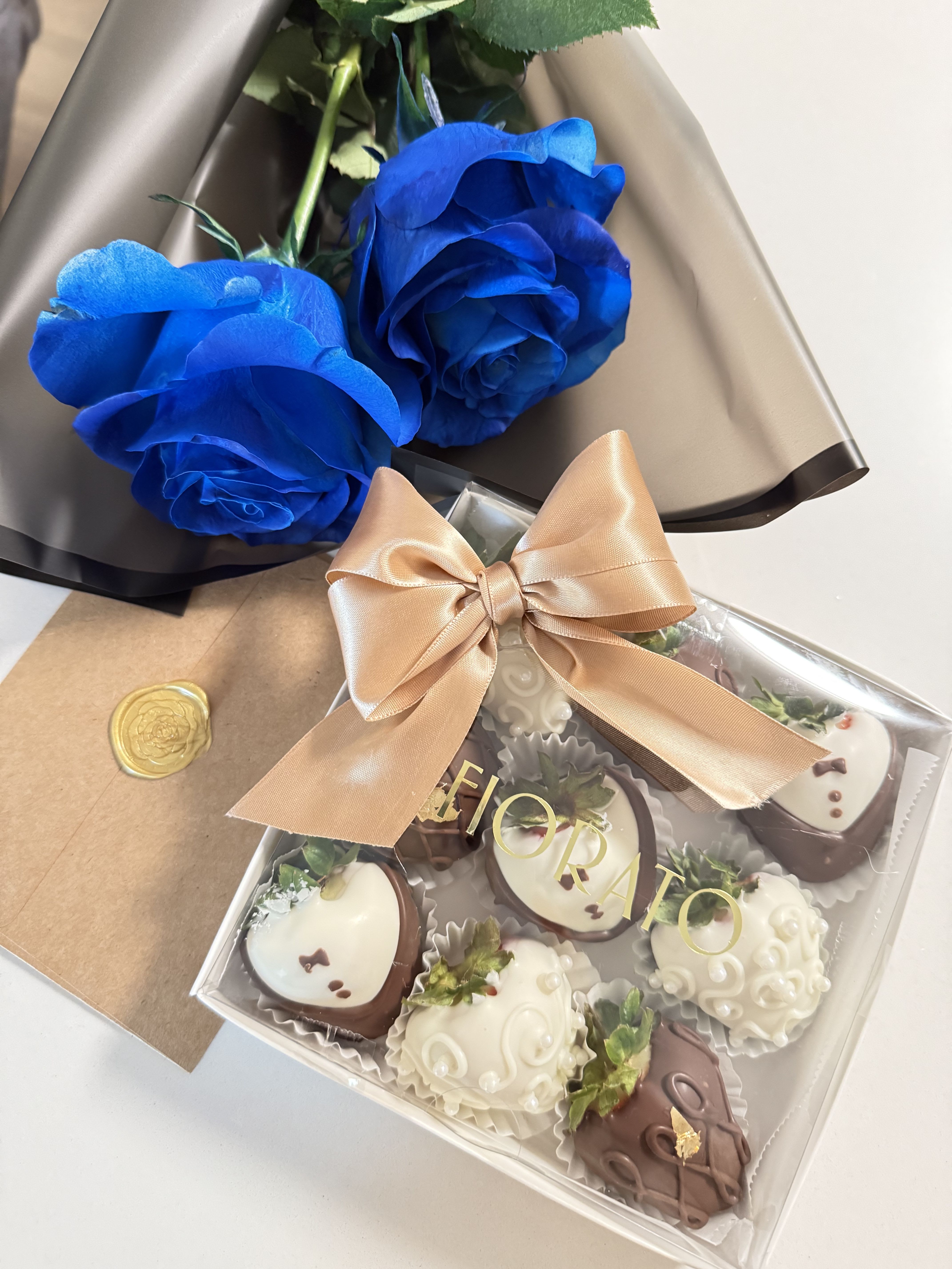 Forever Blue Box - An elegant combination of deep blue roses and 9 hand-decorated chocolate-covered strawberries. Each detail is designed to create a luxurious and unforgettable gift — perfect for celebrating love, gratitude, or any special occasion.