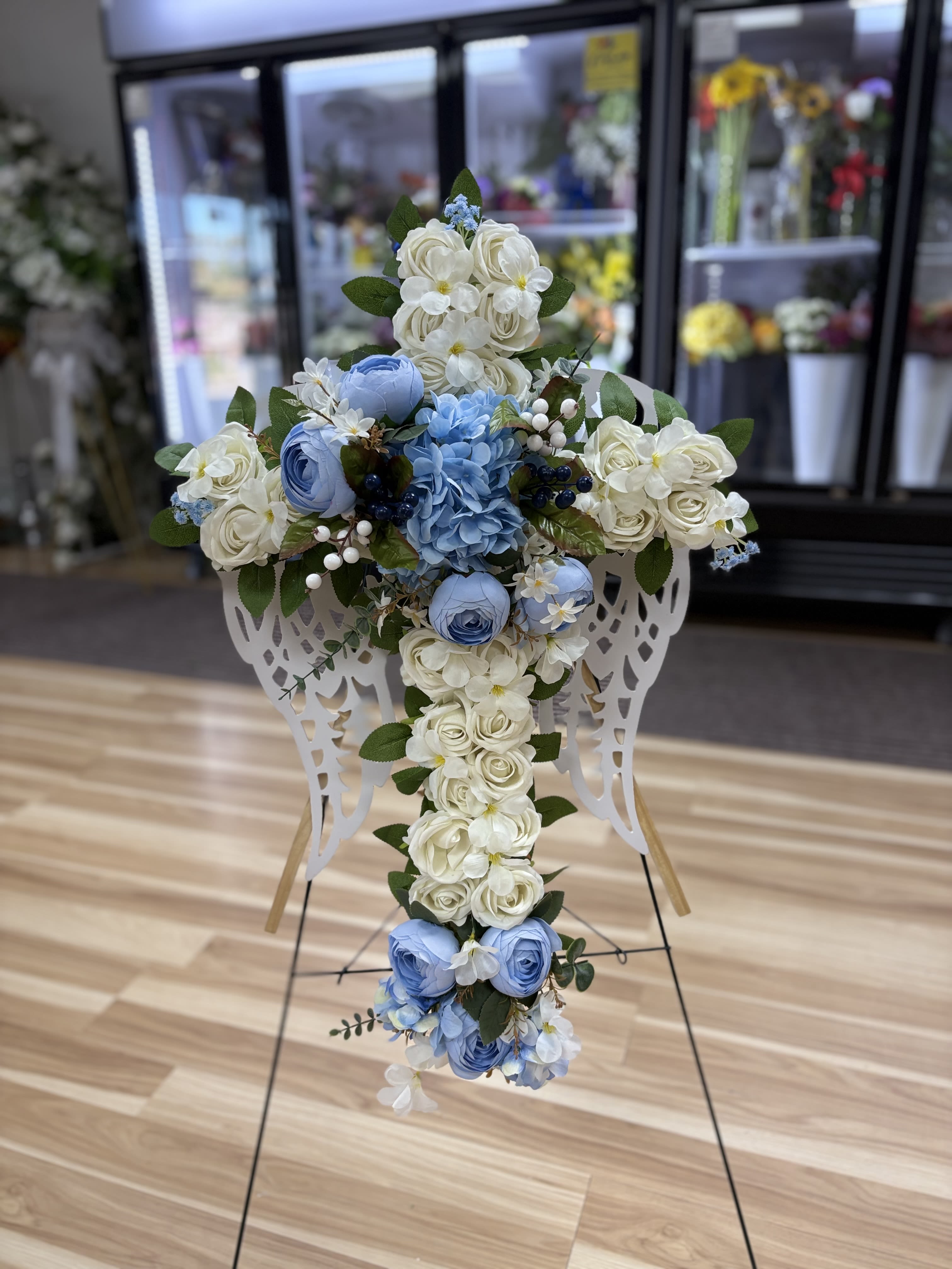 Blue Alas Cross  - Wings with cross in the middle. 