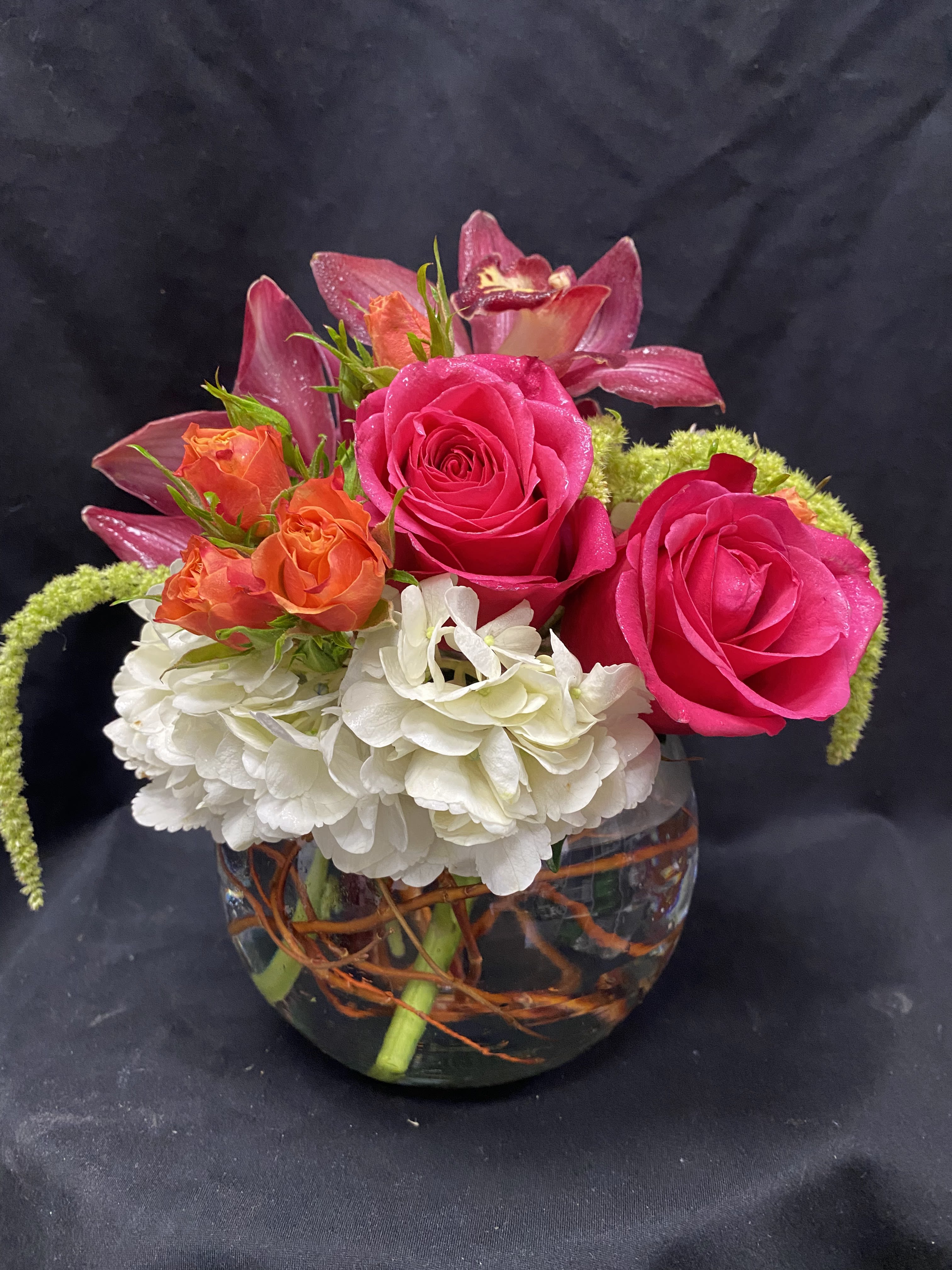 Yours truly - bubble bowl hydrangea, orchids, roses, spray roses, green amaranthus and curly willow