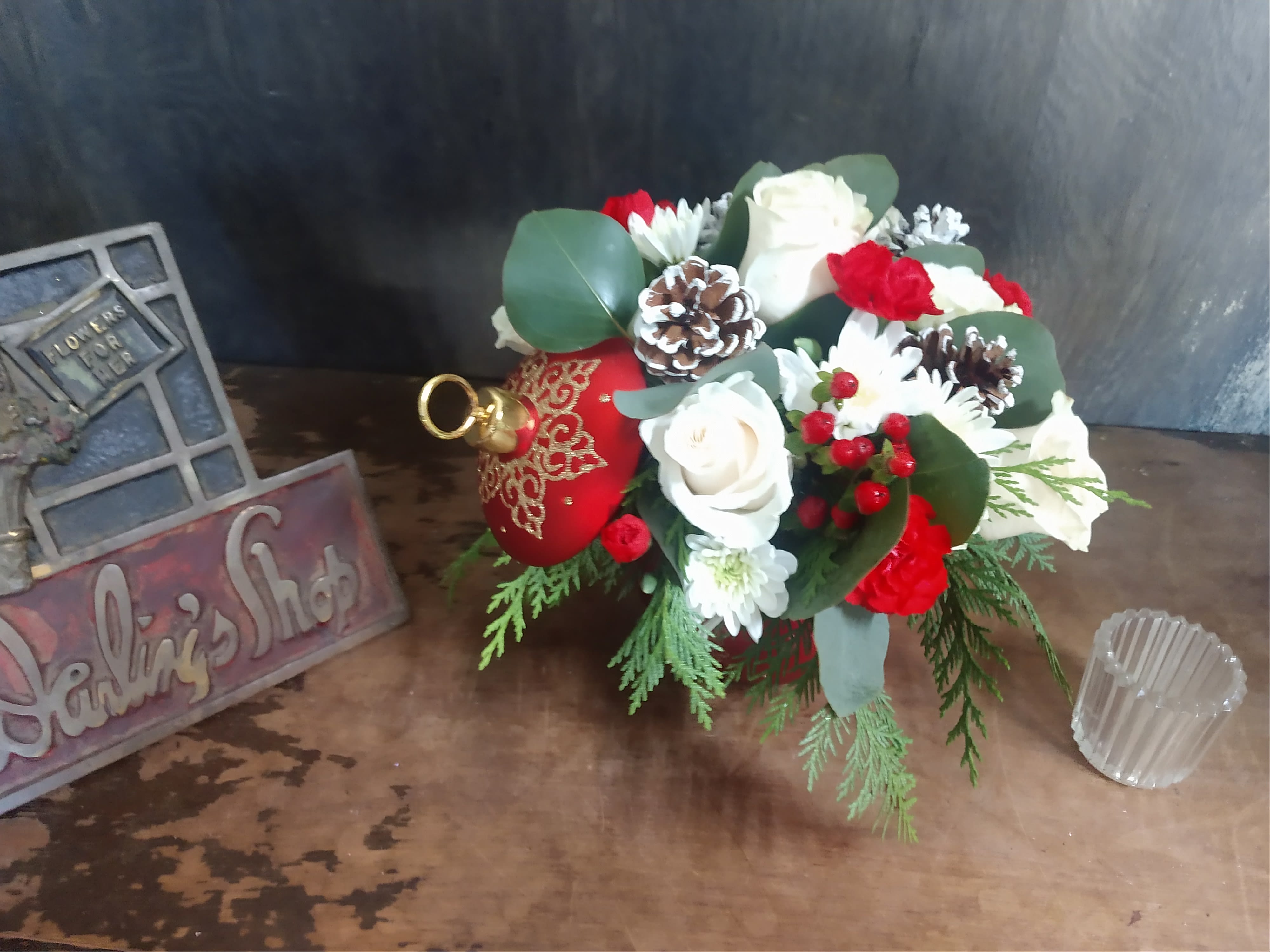 Christmas wishes - Assorted red and white flowers and pine.  Roses, carnations, pom poms