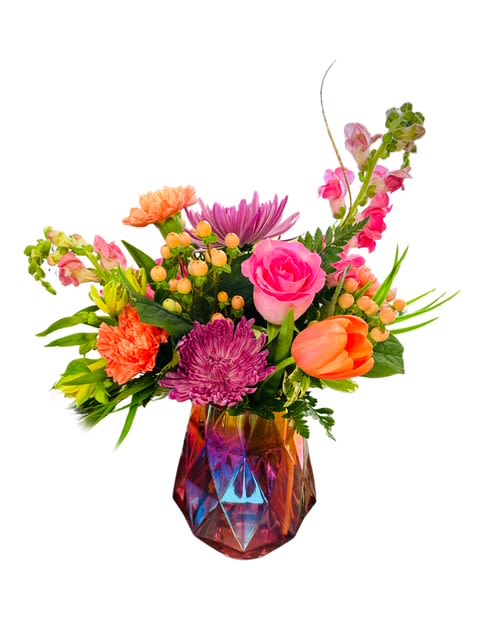 Radiant Joy Bouquet - Bright, cheerful, and full of life- this vibrant arrangement brings instant happiness to any room! Featuring a lively mix of pink roses, orange tulips, coral carnations, lavender mums, and sunny accents. Its beautifully arranged in a shimmering vase. This bouquet captures the essence of everyday joy and colorful charm. - vase may have to be substituted.