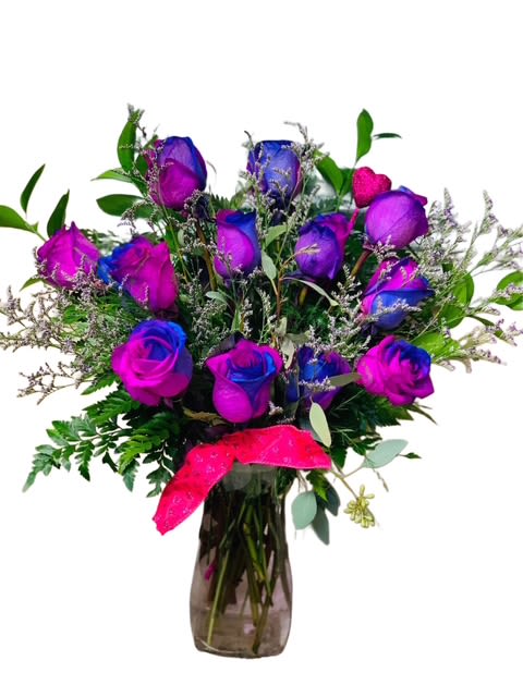 Enchanted Twilight Roses - Vibrant and captivating, this stunning bouquet of blue and purple roses brings a sense of magic and mystery to any space. Accented with airy filler blooms and lush greenery, these uniquely colored roses are arranged in a sleek vase and tied with a bold ribbon. Perfect for making a striking impression—ideal for birthdays, celebrations, or anyone who loves something out of the ordinary.