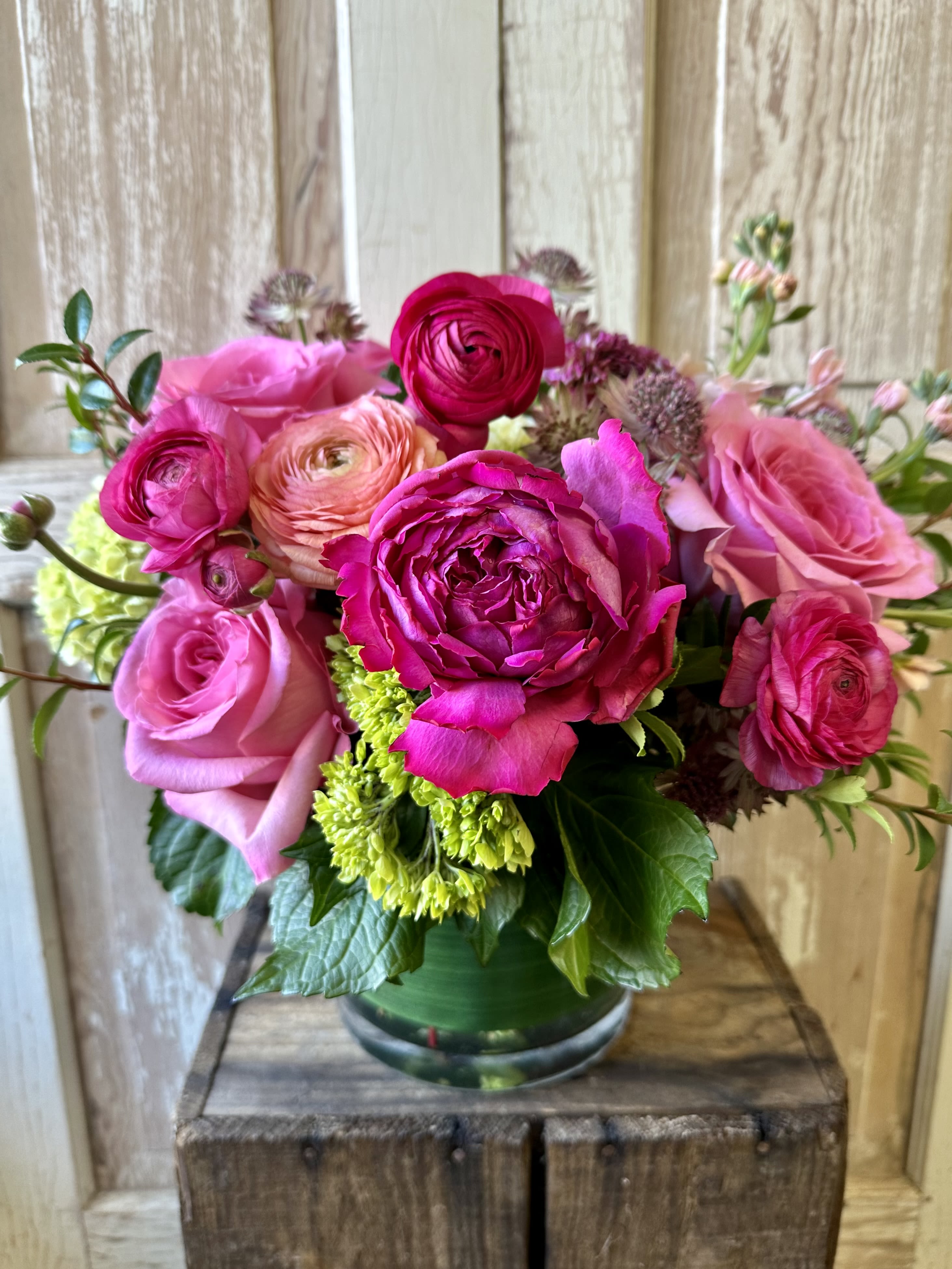 Pretty in Pink - An enchanting bouquet of fresh premium pink flowers. A must have for a pink lover! NOTE : This arrangement will vary seasonally, but we guarantee whatever season it may be....it will be show stopping!