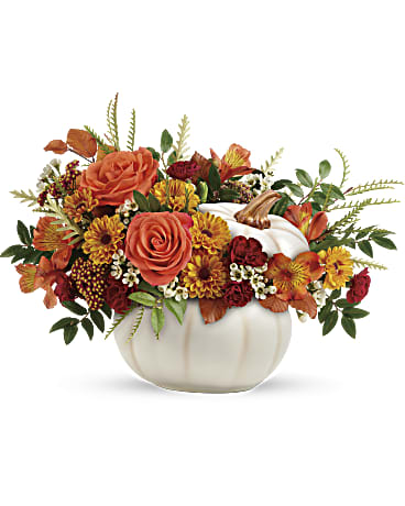 Enchanted Harvest Bouquuet Enchanted Harvest Bouquuet - Add a touch of enchantment to your fall gatherings with this magnificent mix of autumnal roses and mums, gathered in a white ceramic pumpkin that's sure to be an annual décor favorite!