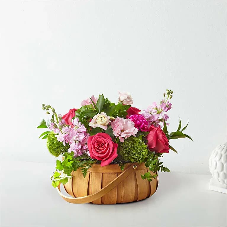 Radiance in Bloom Flower Basket Radiance in Bloom Flower Basket - Inspired by vibrant hues and gentle textures, this arrangement from Fort Lauderdale Florist by DGM Flowers will delight your loved ones. Featuring a stunning mix of roses, carnations, and lisianthus, it’s artfully arranged in a woven basket. Basket shown may be substituted with a wicker basket based on availability.     DETAILS  Standard (approx. 11"H x 16"W) Deluxe (approx. 12"H x 17"W) Premium (approx. 13"H x 18"W) Ultra-Premium (approx. 14"H x 19"W). For long-lasting blooms, add water daily.    BLOOM DETAILS  Carnation Rose Stock