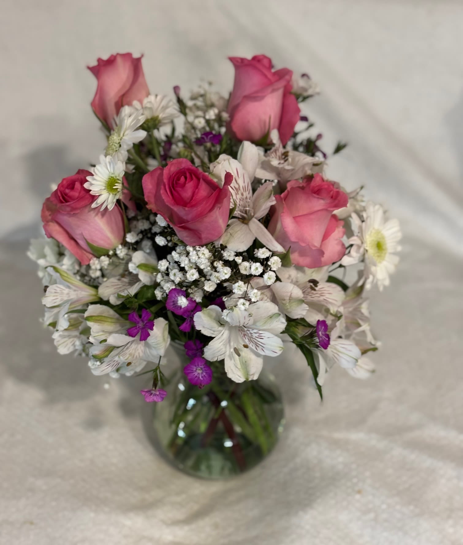 Everyday Flower Bouquet Everyday Flower Bouquet - This sweet bouquet featuring Carnations with roses and Alstroemeria and more flowers makes a very thoughtful gift for someone special.