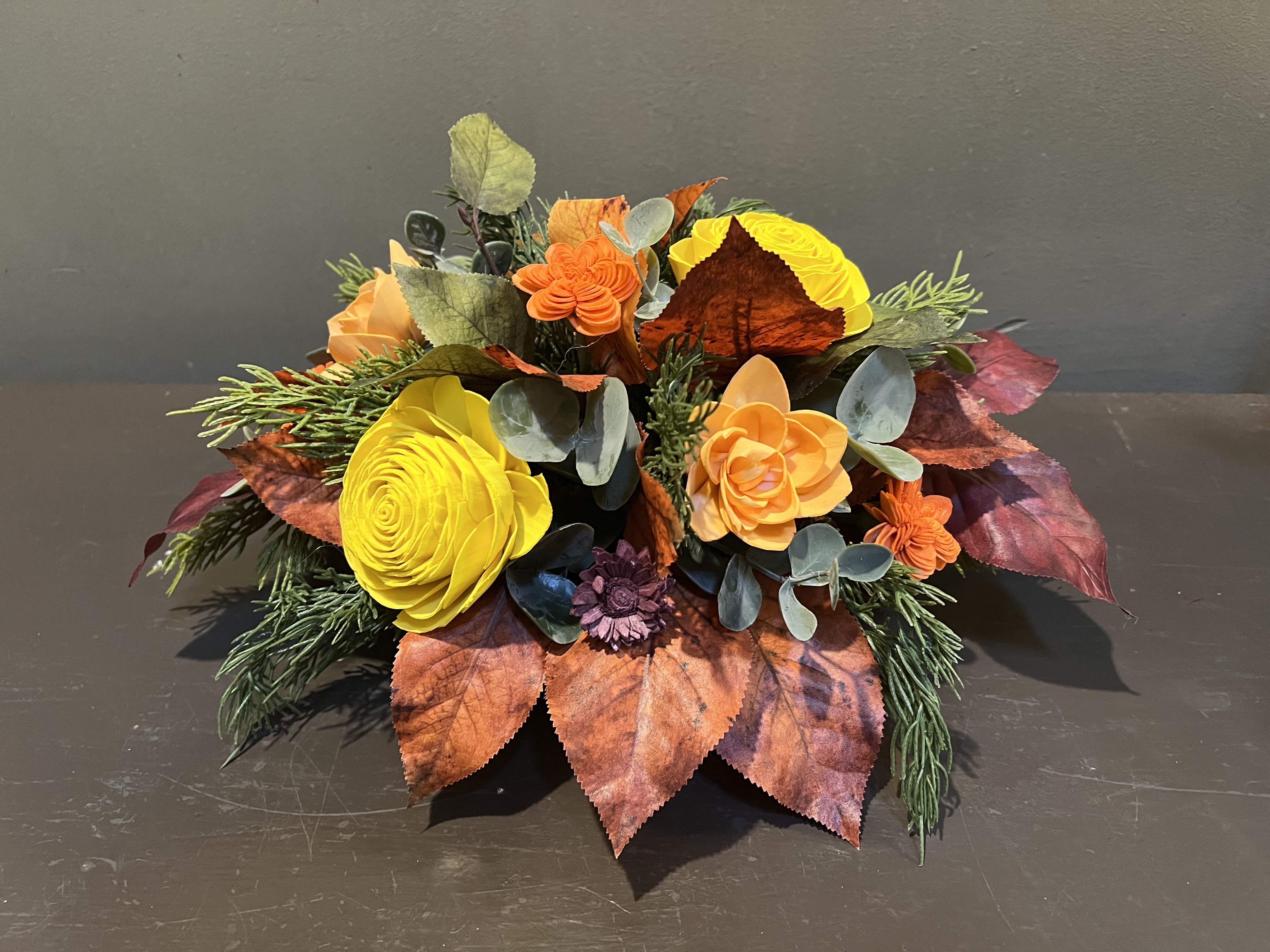 Sola Wooden Flower Centerpiece - Autumn Radiance Sola Wooden Flower Centerpiece - Autumn Radiance - Hand-dyed and hand-crafted in Minneapolis, these flowers made of balsa wood are a wonderful everlasting floral arrangement - great for those with allergies! Can be used as a natural essential oil diffuser too! Arrives in a white ceramic pumpkin. Approx. Dimensions: 7"Tx14"W