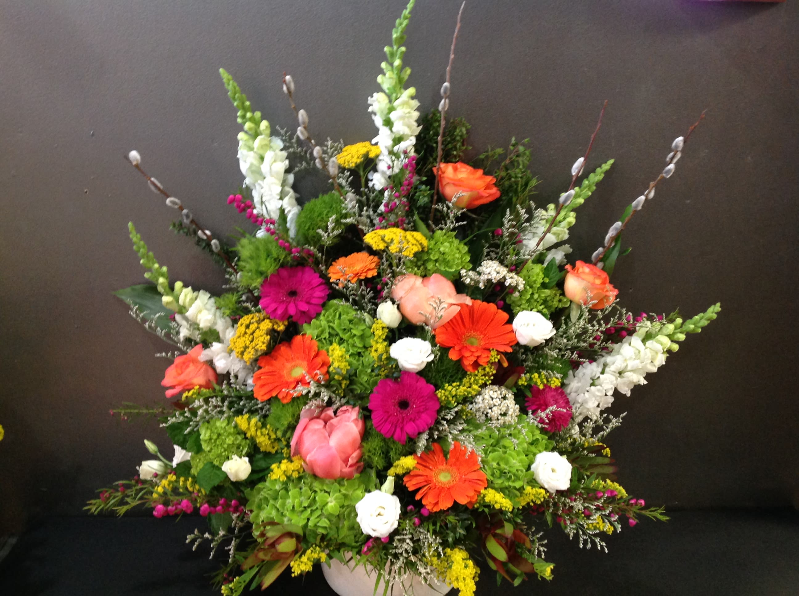 Bright Funeral Basket - Beautiful funeral basket with fresh bright flowers.