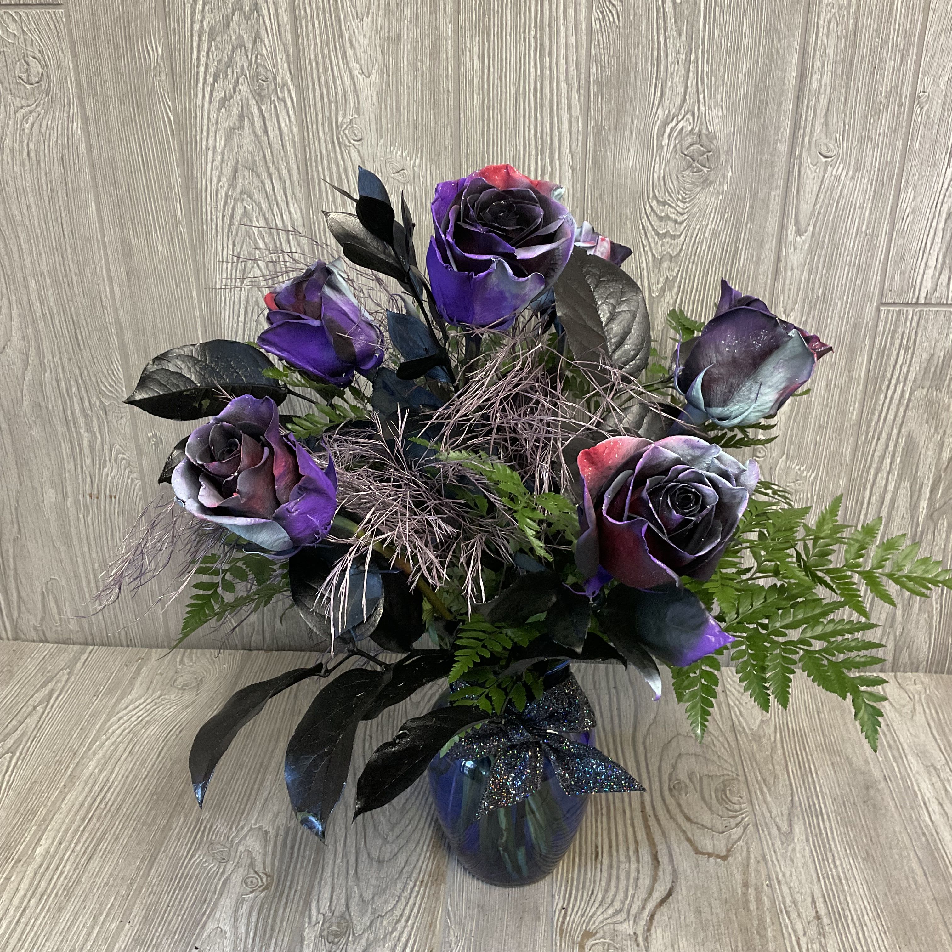Halloween Roses  Halloween Roses  - Assorted spooky roses arranged in a vase.  Available in 3 sizes.  More options available if you give us a call.