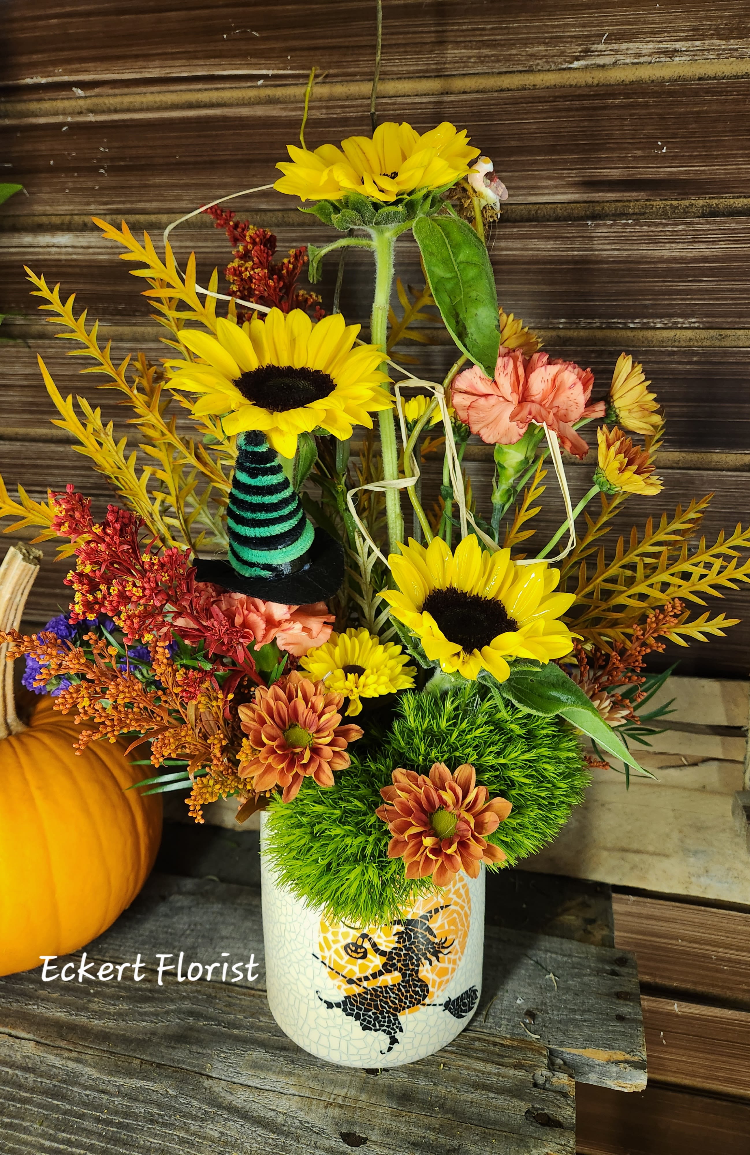 Eckert Florist's Halloween Witch Bouquet *Our Local Delivery Only Eckert Florist's Halloween Witch Bouquet *Our Local Delivery Only - Designed in a witch's Halloween ceramic container, this fresh arrangement will be the hit of the day. Fresh flower variety and colors may vary. *Our Local Delivery Only