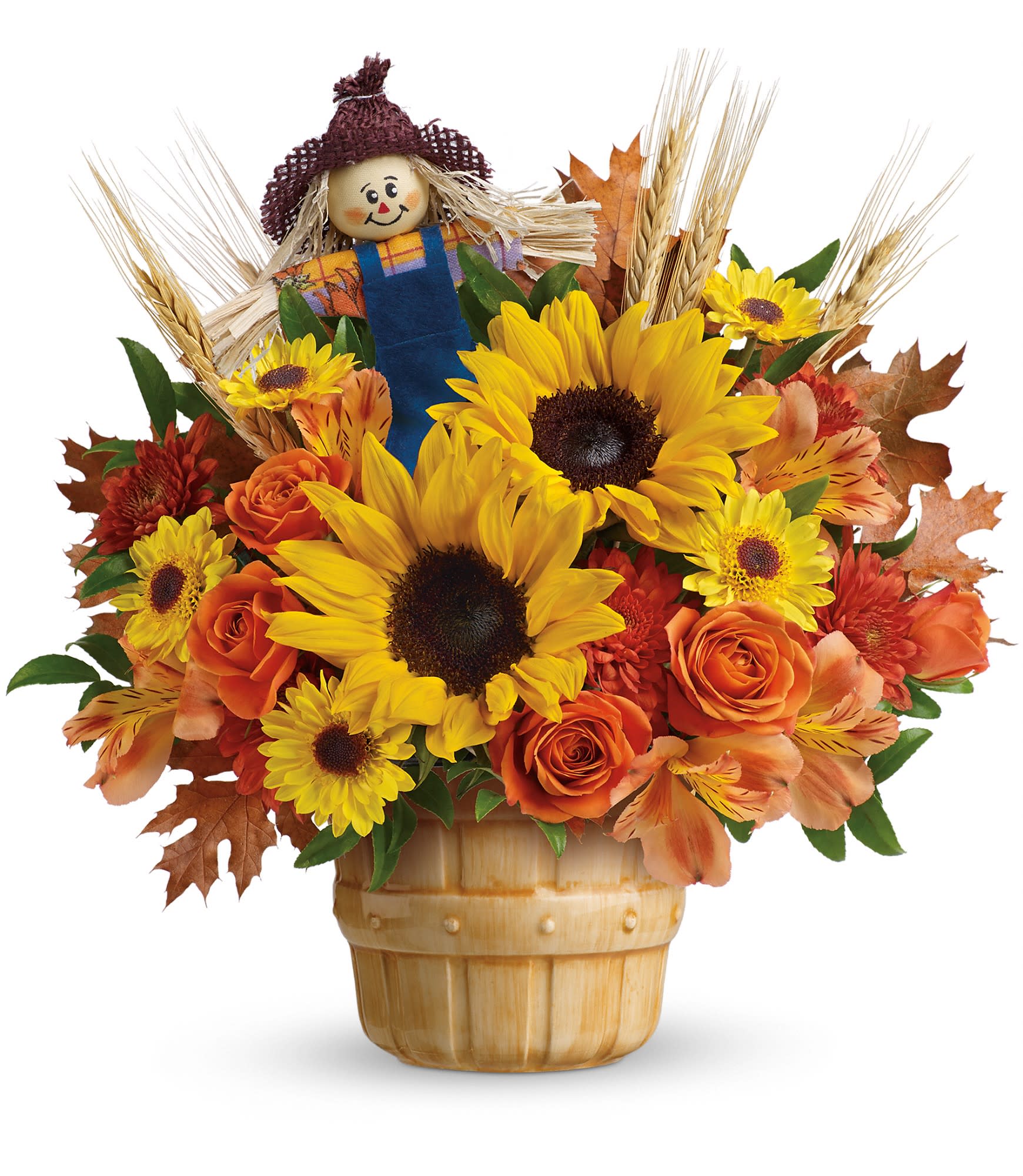 Smiling Scarecrow Bouquet - Look who just cropped up! This friendly scarecrow spreads Thanksgiving cheer with a glorious bouquet of roses, alstroemeria and sunflowers, presented in a sweet ceramic apple basket.  Orange spray roses, orange alstroemeria, yellow sunflowers, bronze cushion spray chrysanthemums and yellow viking daisy spray chrysanthemums are accented with huckleberry, wheat and brown transparent oak leaves. Delivered in a Smiling Scarecrow ceramic basket. Approximately 13&quot; W x 13&quot; H