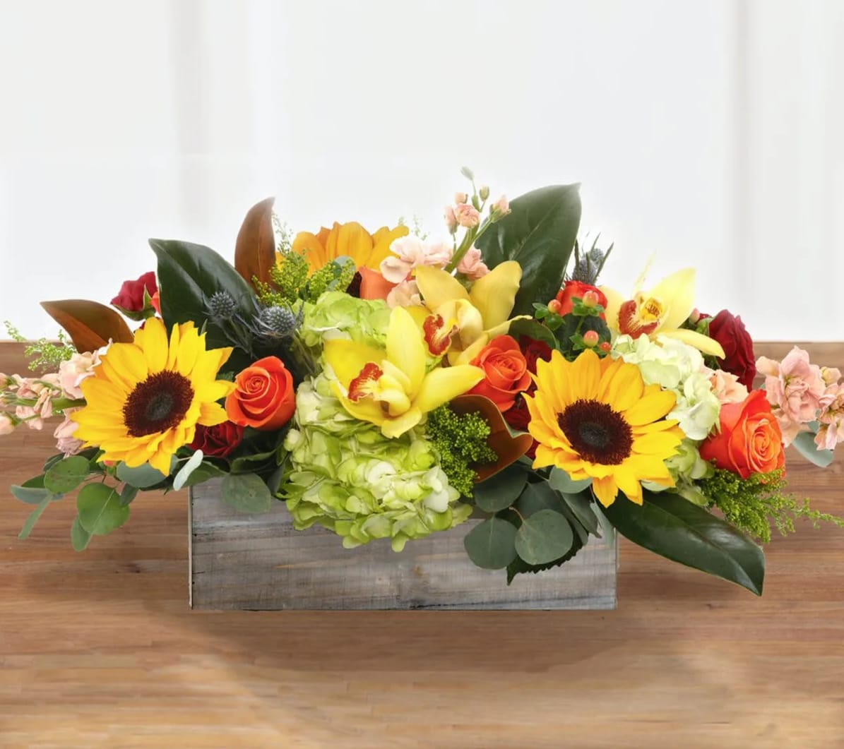 Harvest Sunflower Centerpiece - A beautiful traditional fall centerpiece of mixed autumn colors, showcasing festive sunflowers.