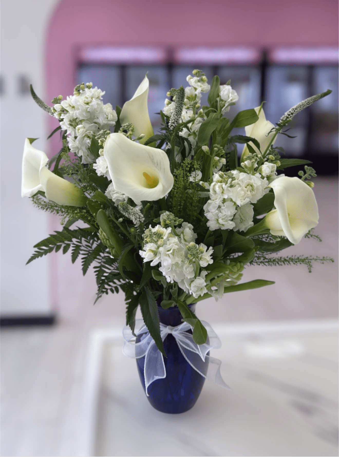 Elegant Cala - Please note that florists may need to make substitutions based on inventory to ensure the freshest blooms are delivered, while maintaining the arrangement's overall aesthetic.