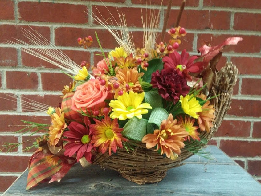 Fall Cornucopia Fall Cornucopia - Beautiful fall cornucopia is filled with long lasting flowers perfect for a Thanksgiving table!