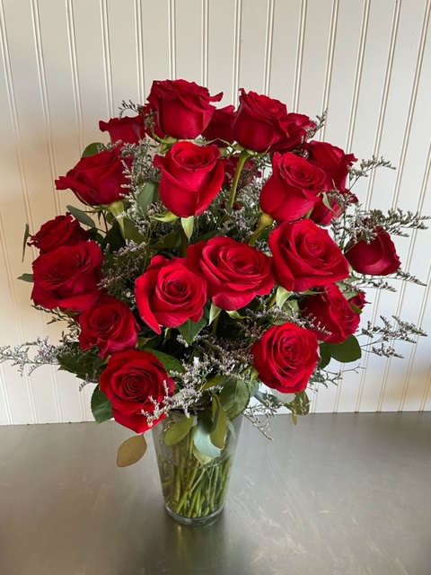 Celeste Trente-six 36 - Send someone special three dozen of the finest red Roses raised in the Andean Mountain range of Ecuador and Columbia accented with fresh greens and Limonium or, if you prefer, just greens.  Artfully arranged in a vase by our skilled designers.
