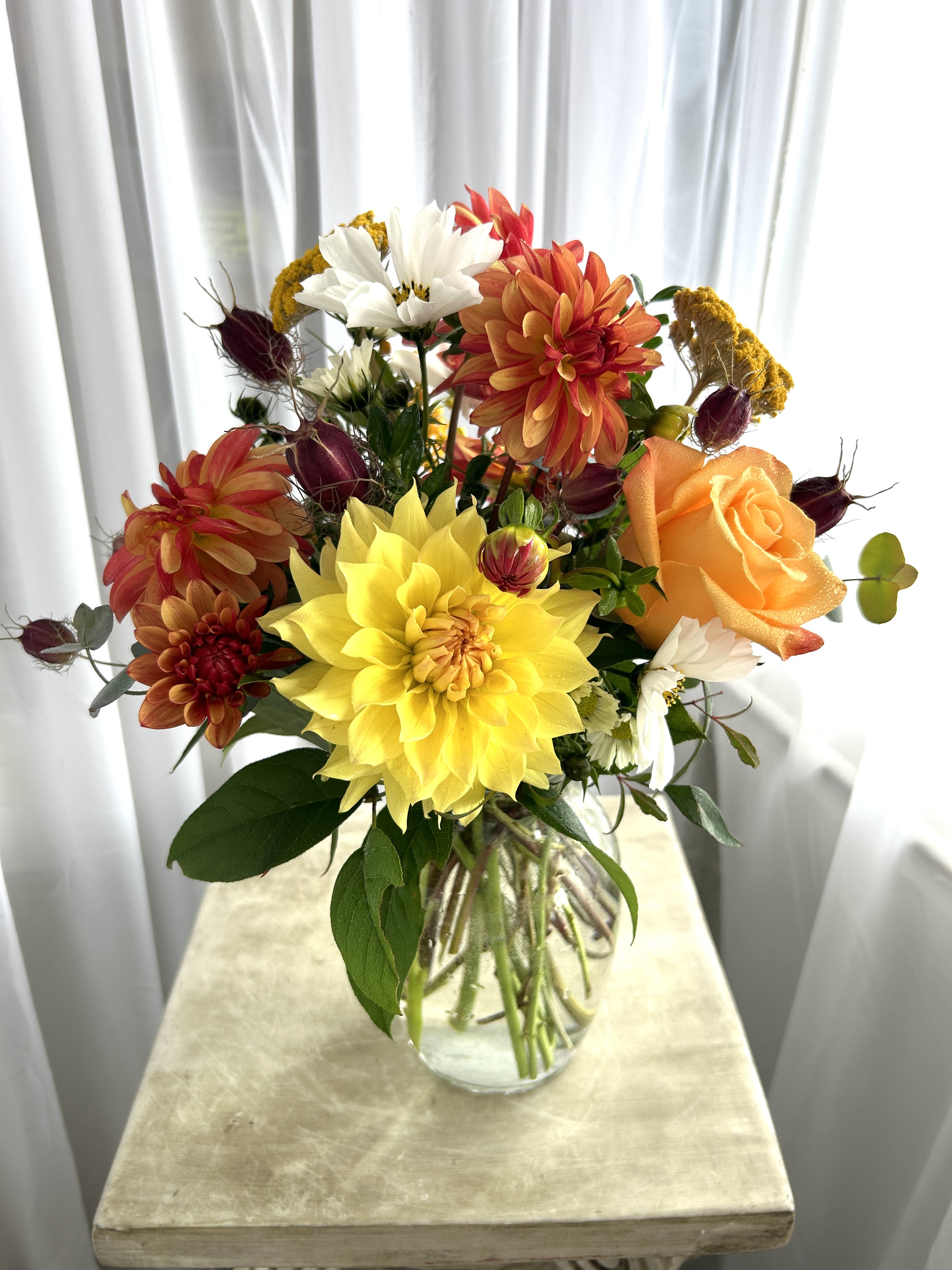 Simple Autumn Vase Arrangement - A sweet, small, and simple touch of fall!  As always, call shop to find out what we have in stock, because our inventory of flowers changes constantly; so your order probably will not match the picture exactly.