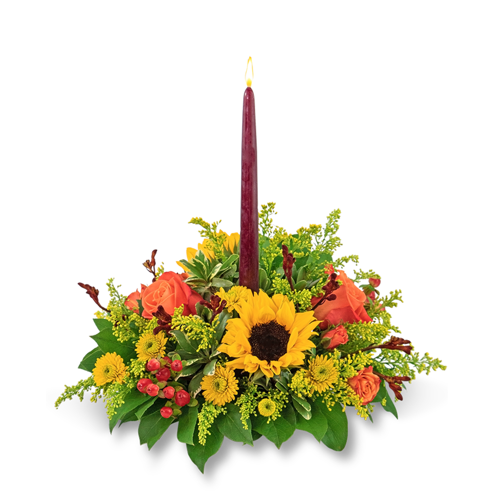 Autumnal Equinox Centerpiece - Our Autumnal Equinox Centerpiece will bring warmth and beauty to any holiday table or Thanksgiving celebration. This fresh centerpiece features bright sunflowers, button spray mums, orange roses, hypericum berry, solidago, and other premium foliage gathered around an elegant tapered candle. Fresh flowers are the perfect complement to your Thanksgiving tablescape.