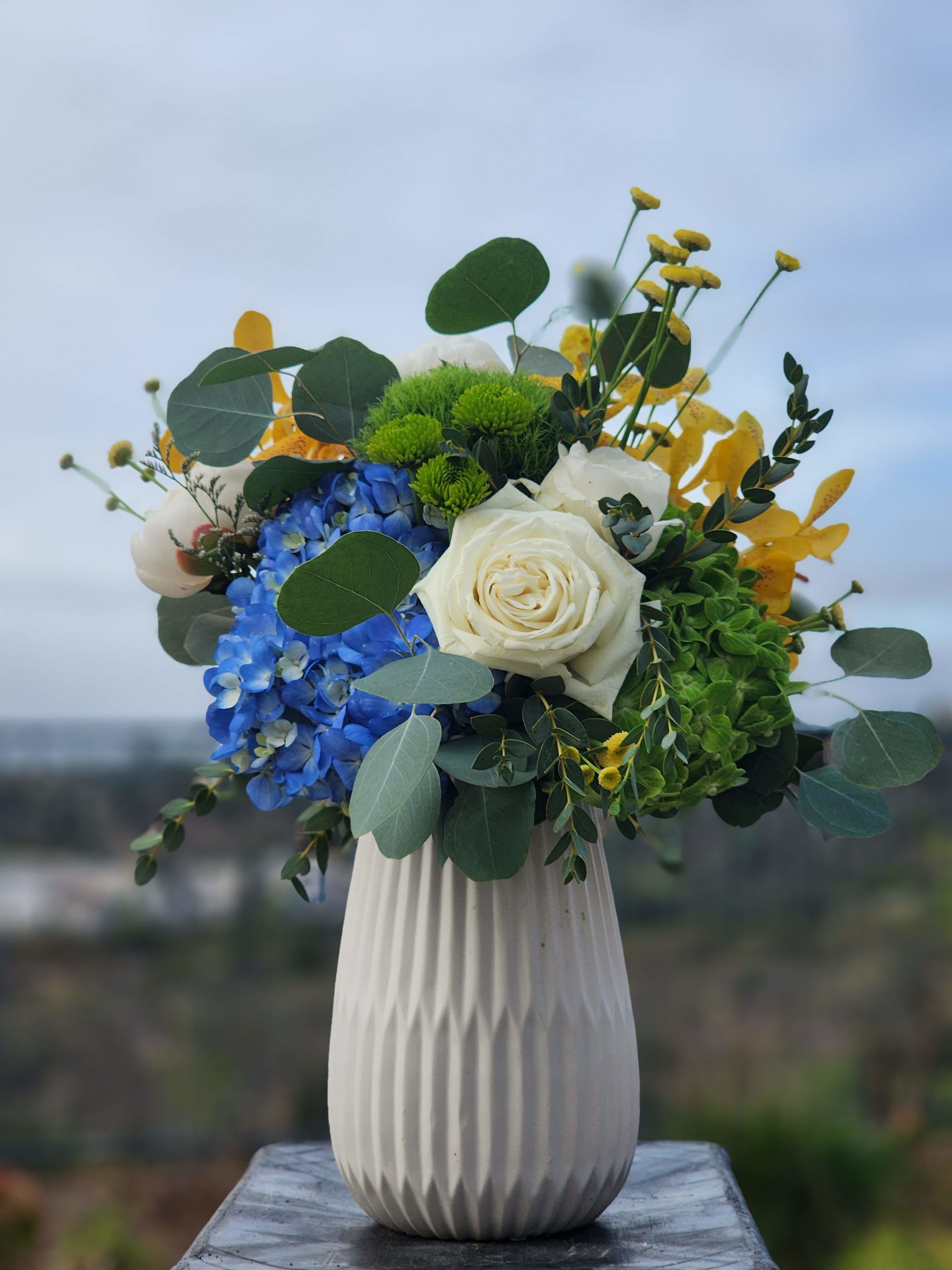 Modern Elegance - A beautiful arrangement of colorful flowers, in a beautiful vase that can be a great keepsake.