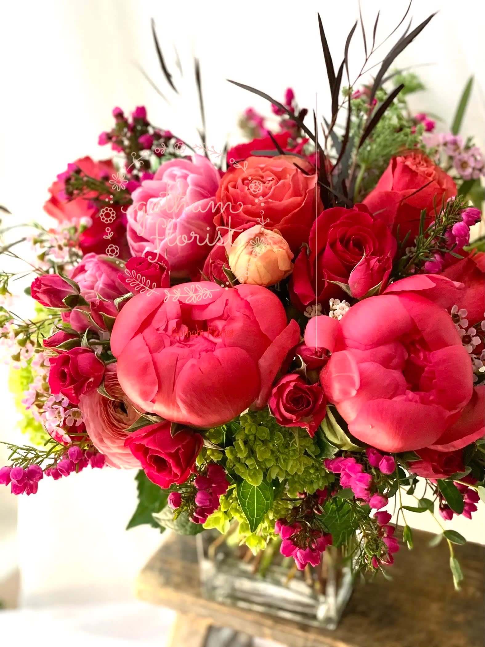 Delicious Delicious - Hot pink roses, peonies and tulips in a clear vase. Send the best flowers from the best flower shop in New York. We offer same day flower delivery in Manhattan, Queens, Bronx, Brooklyn, Staten Island and West Chester counties. We have the prettiest and most luxurious flowers to choose from and our designs are unique and whimsical. We carry Peonies almost every day of the year!! #bestflorist #bestfloristny #newyorkflorist #coralcharm #coralcharmpeonies #flowershop #samedaydelivery #samedayflowerdelivery #nycflorist #bestfloristny