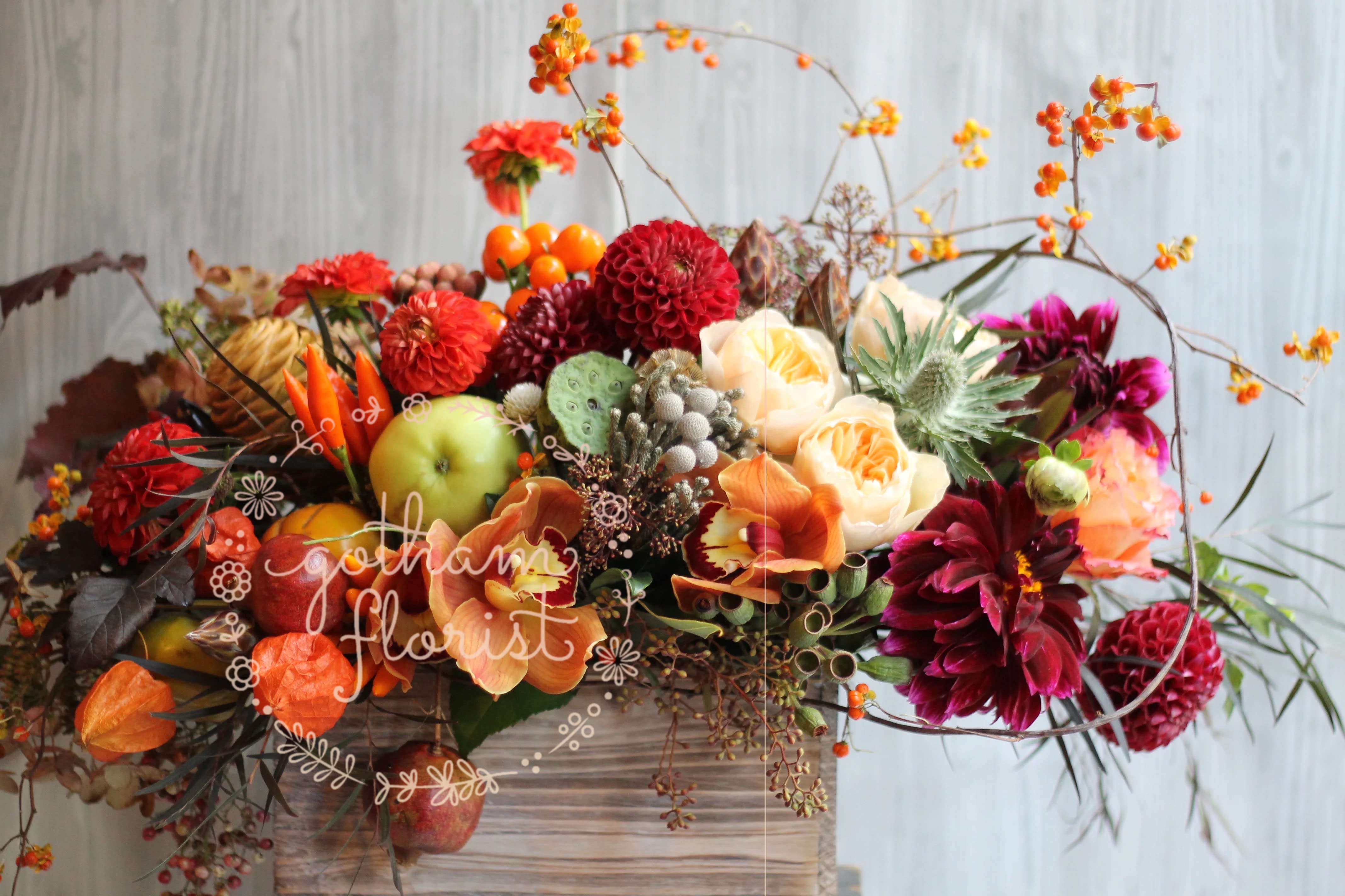 Give Thanks Give Thanks - Wood box filled with fruit and seasonal fall flowers. Design will vary according to market availability. #thanksgivingflowers