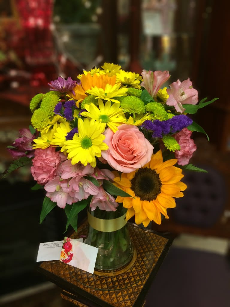 Rainbow Bright Rainbow Bright - This gorgeous vase is so pretty. Like seeing a brilliant rainbow. The mixed colors and textures will bring a smile to their face.  We are proud to deliver our flower creations to the Kenosha, Somers, and Pleasant Prairie area. With over 55 years of combined flower design experience in Kenosha, Wisconsin, A Summer's Garden Florist and Gifts is the perfect choice for the freshest flowers, most creative design, and exceptional customer service.